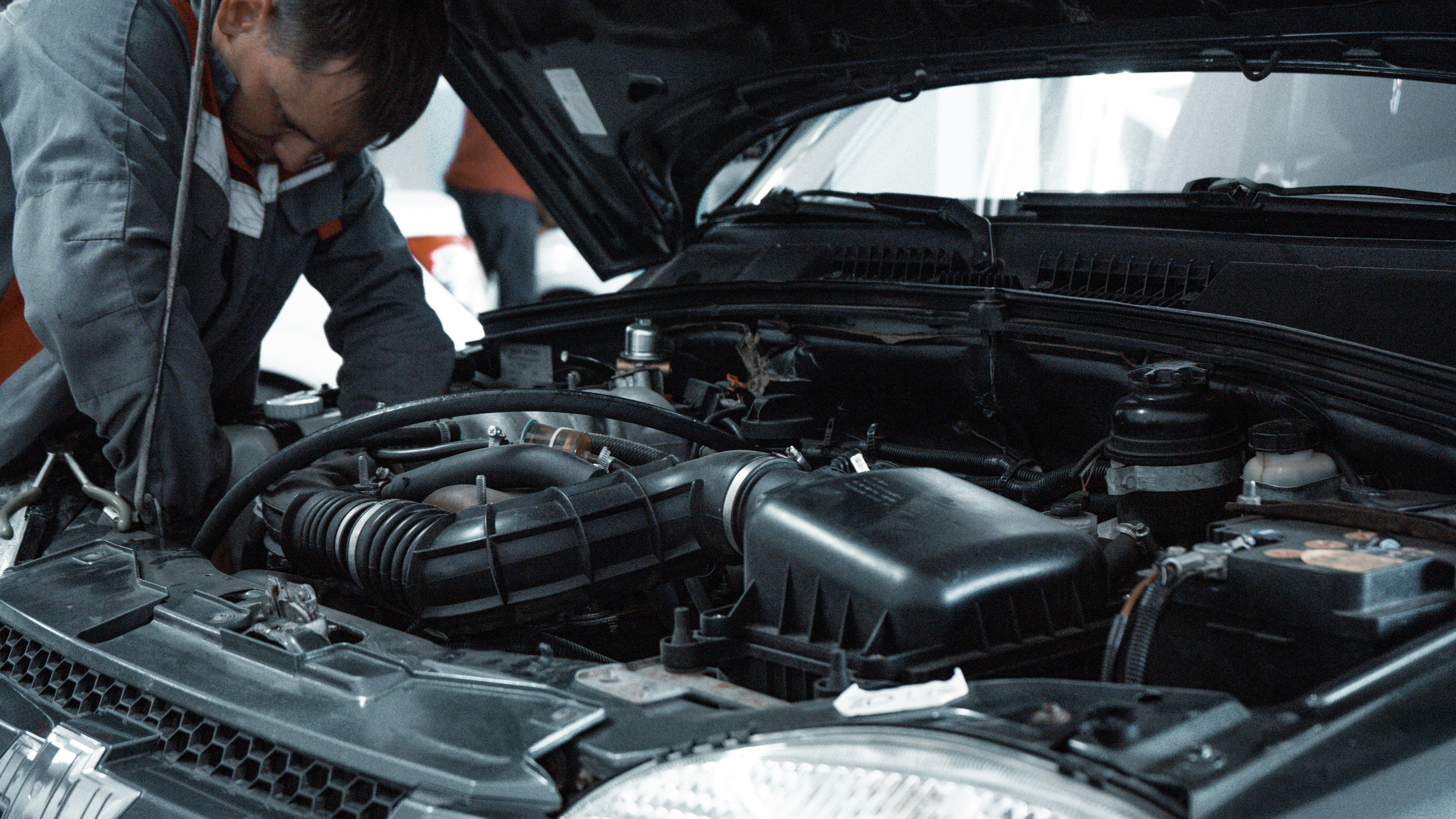 Auto repair shop preparing an invoice for vehicle repair work