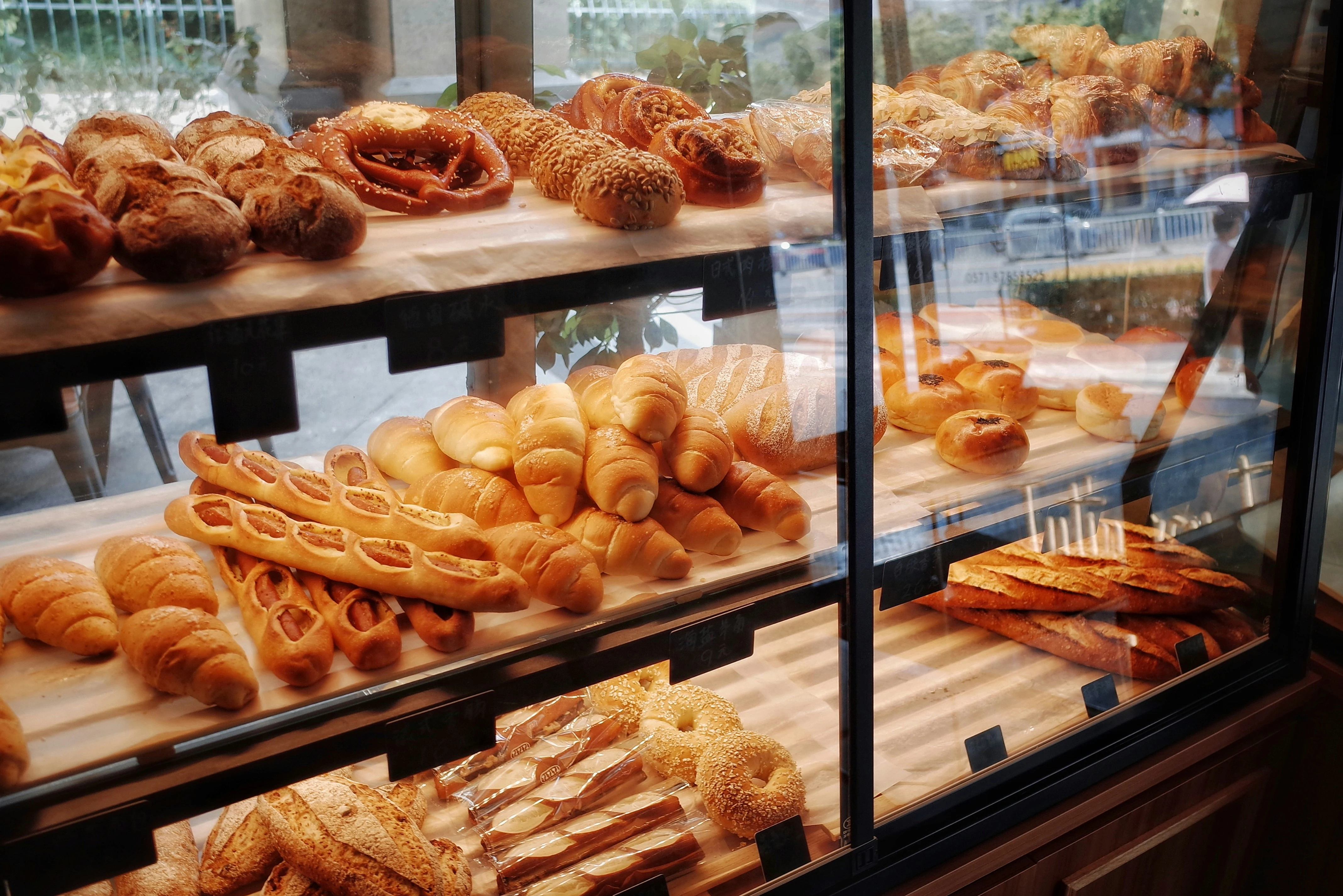 Bakery owner preparing a bakery invoice for customer orders