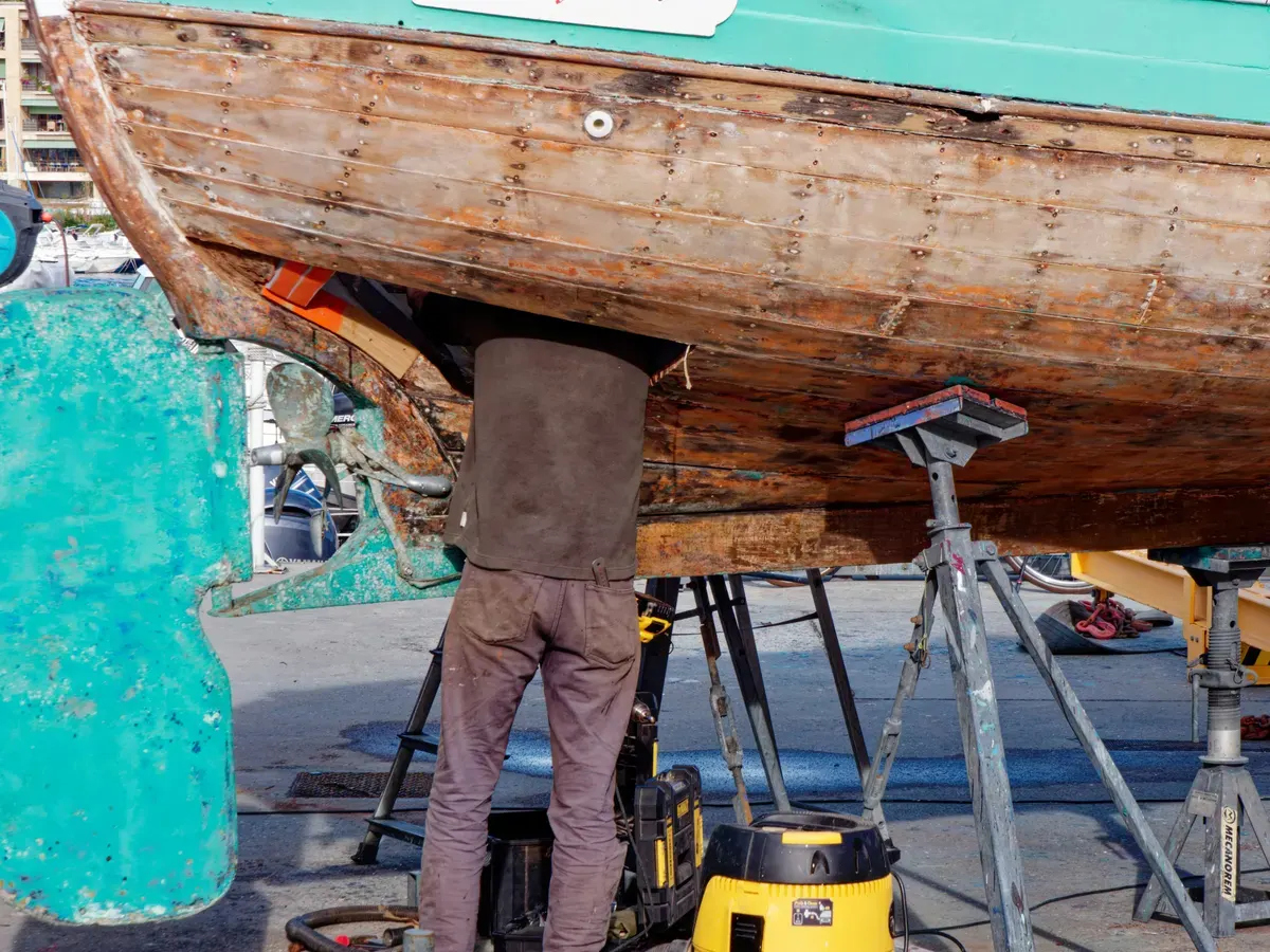 Marine mechanic preparing a professional boat repair invoice