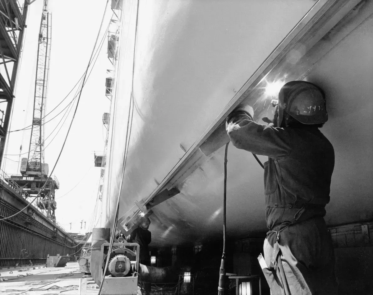 Marine mechanic reviewing a boat repair invoice example