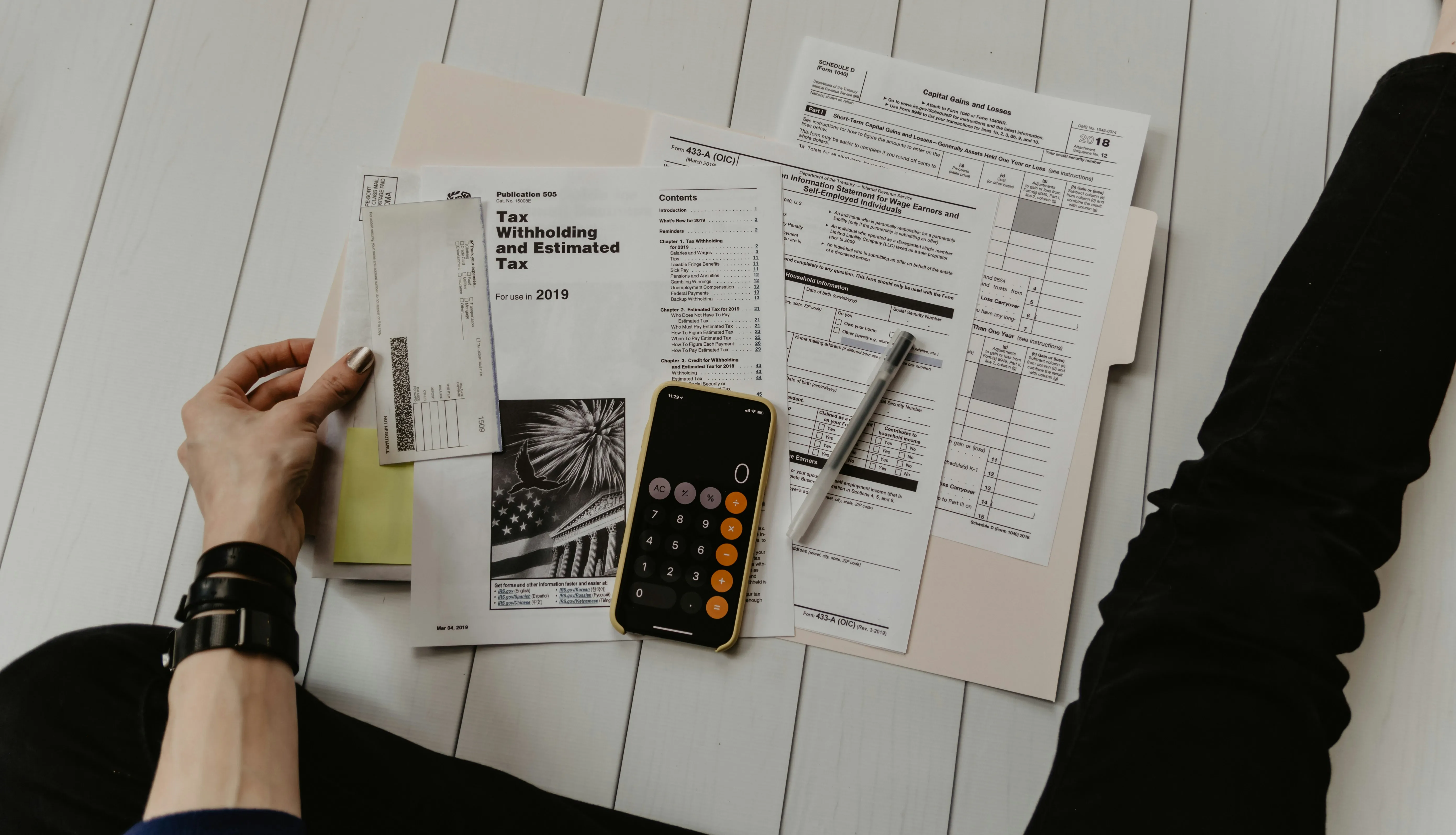 Bookkeeper reviewing a bookkeeping invoice example and monthly bookkeeping invoice