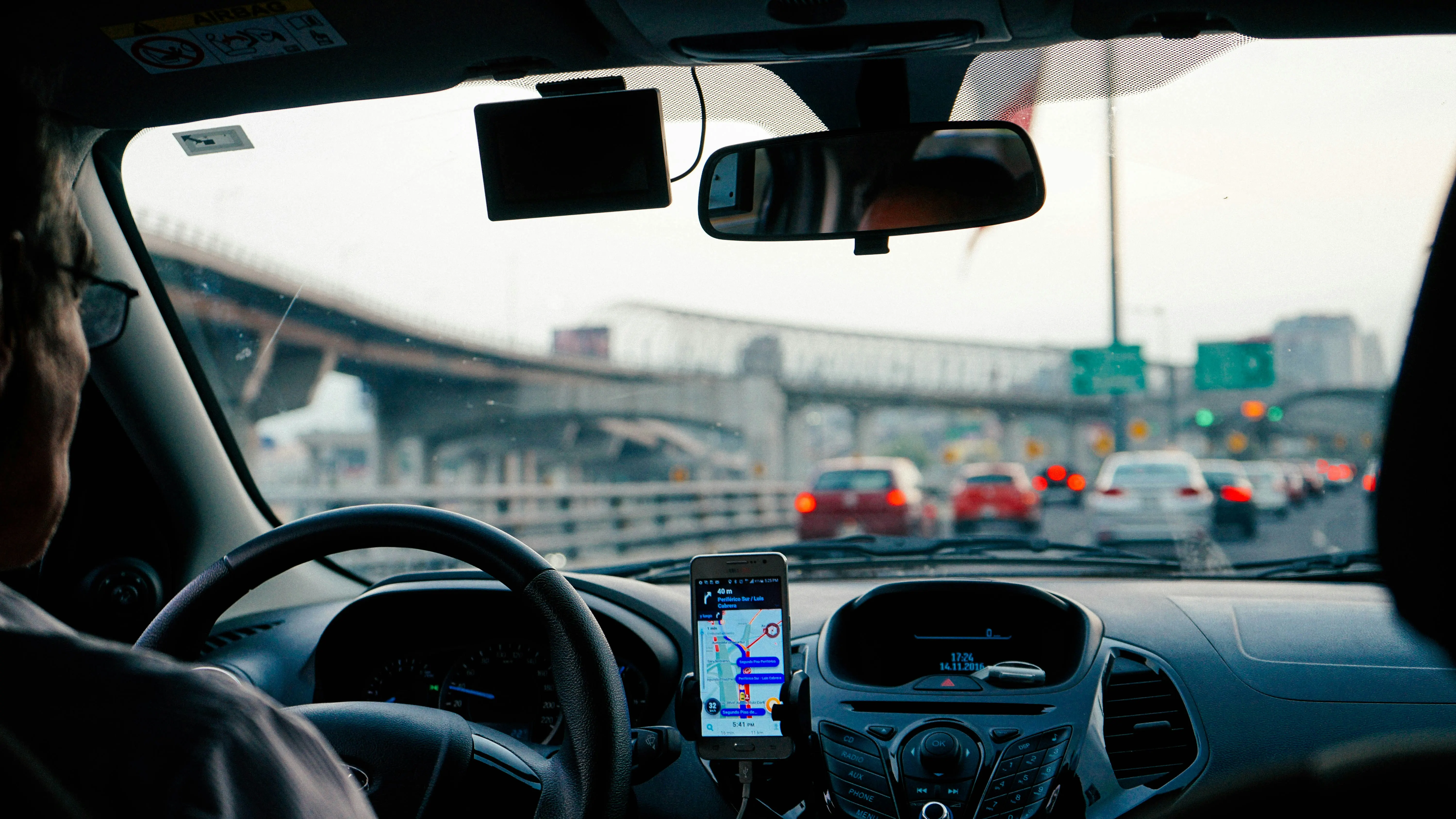 Professional chauffeur preparing an invoice for executive transport services