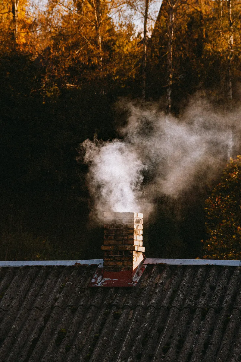 Chimney sweep preparing a professional chimney service invoice