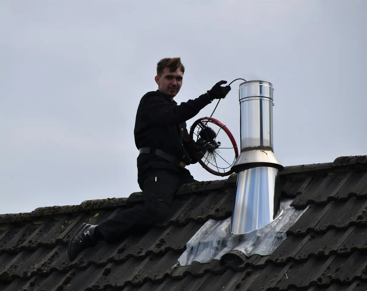 Chimney cleaning contractor completing an editable chimney invoice