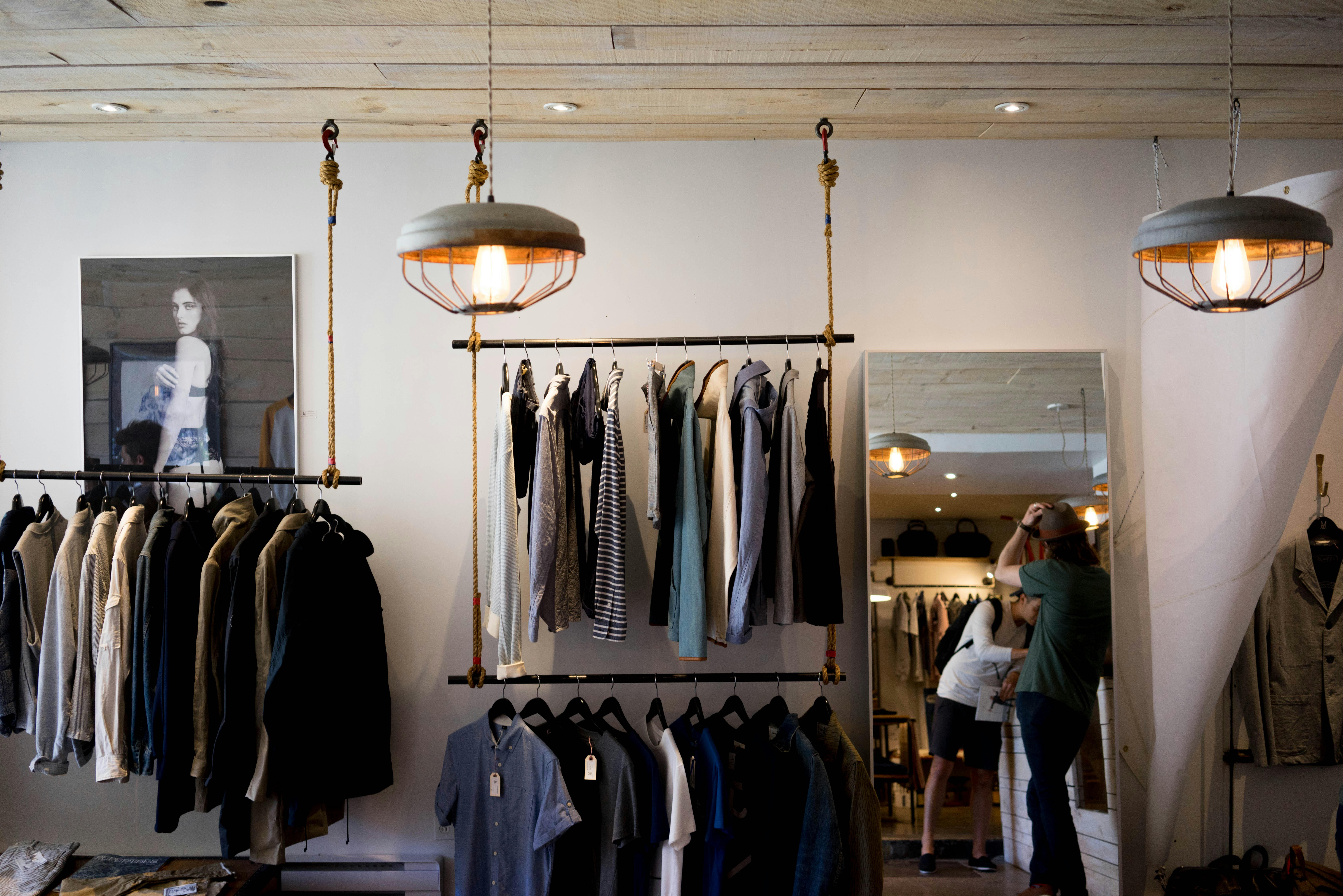 Fashion retailer preparing clothing orders and clothing invoices