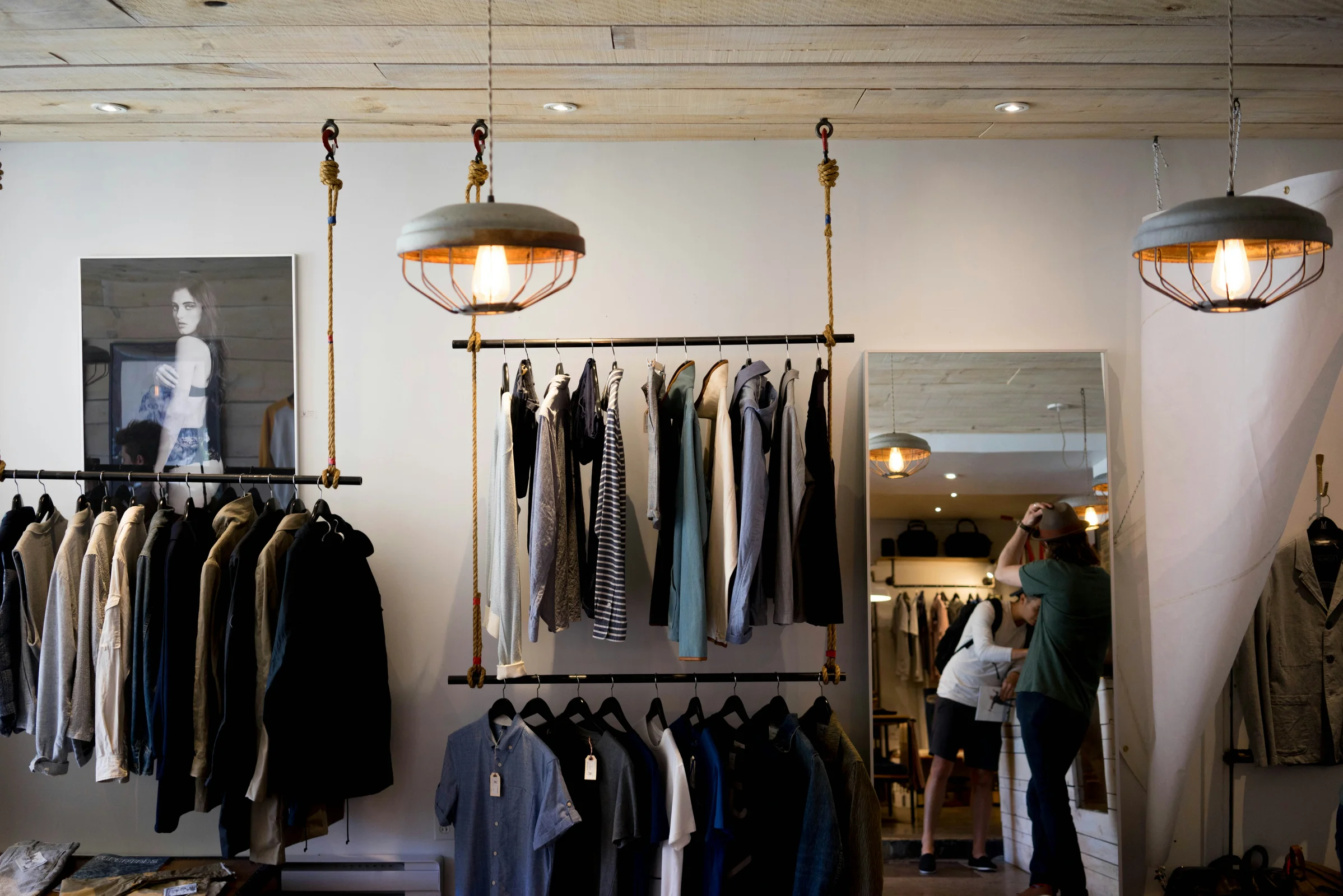 Fashion retailer preparing clothing orders and clothing invoices