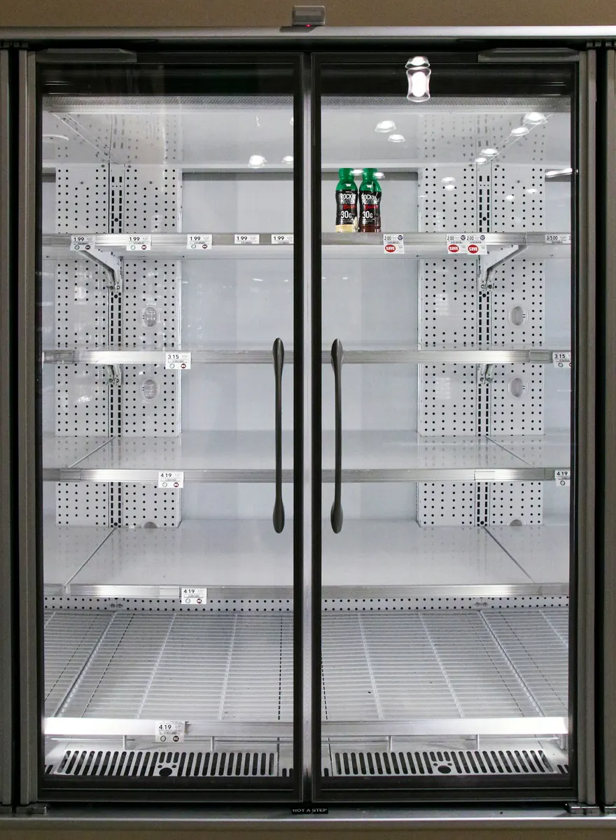 Commercial refrigeration contractor calculating repair and installation costs
