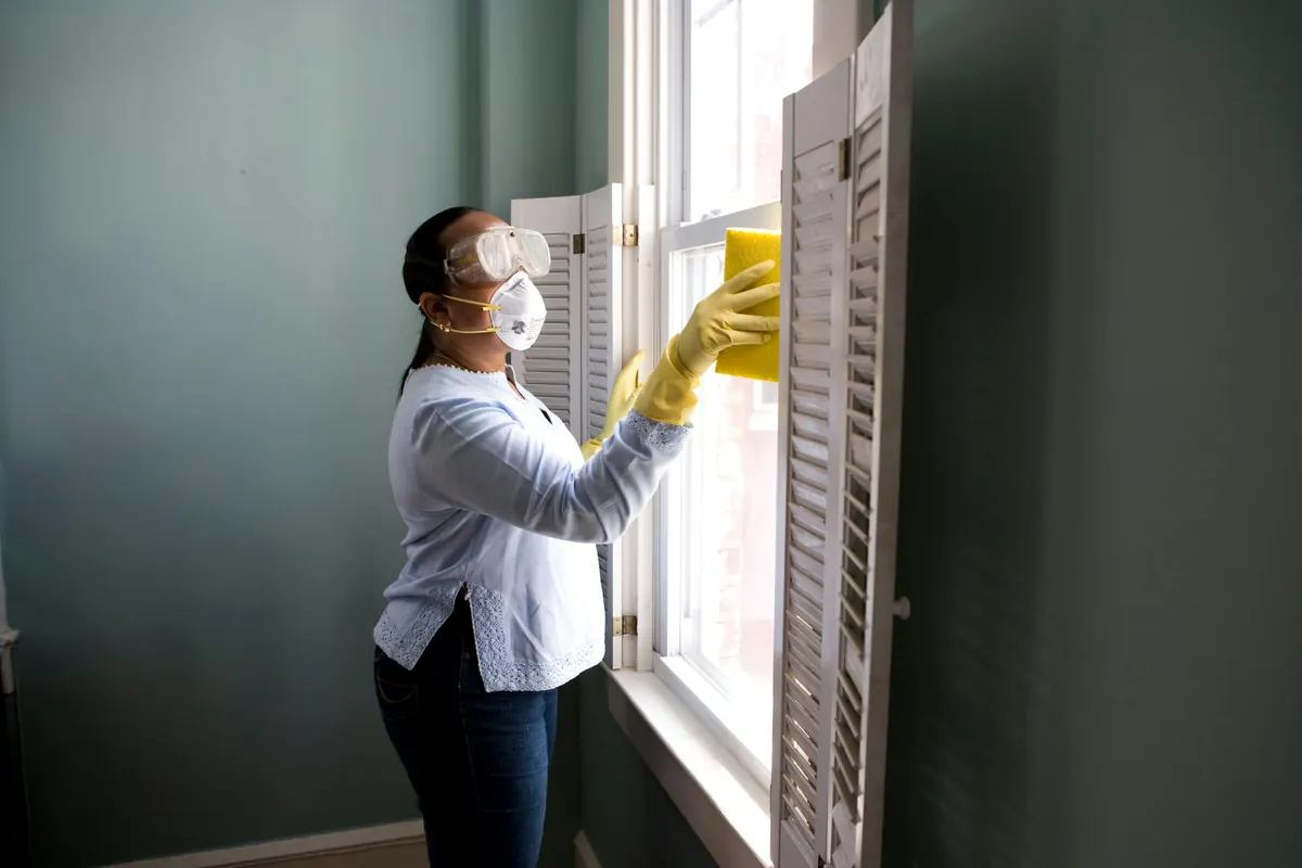 Commercial cleaner preparing a commercial cleaning invoice template after completing office cleaning services