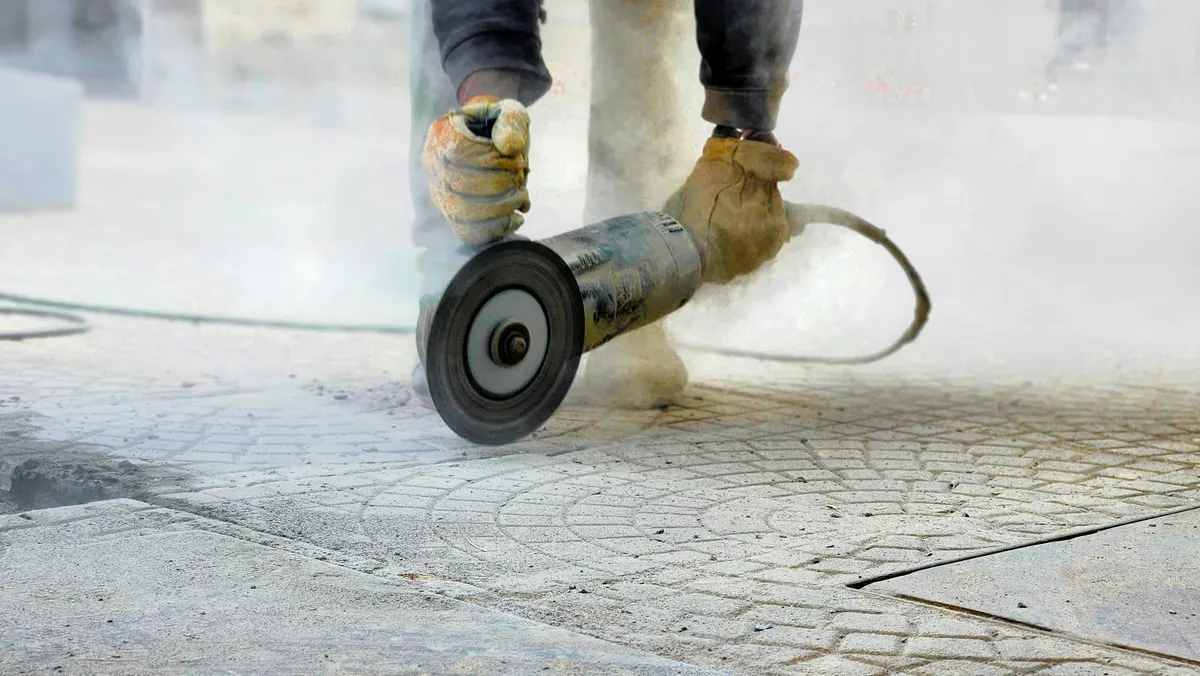 Contractor carrying out concrete sawing and drilling work