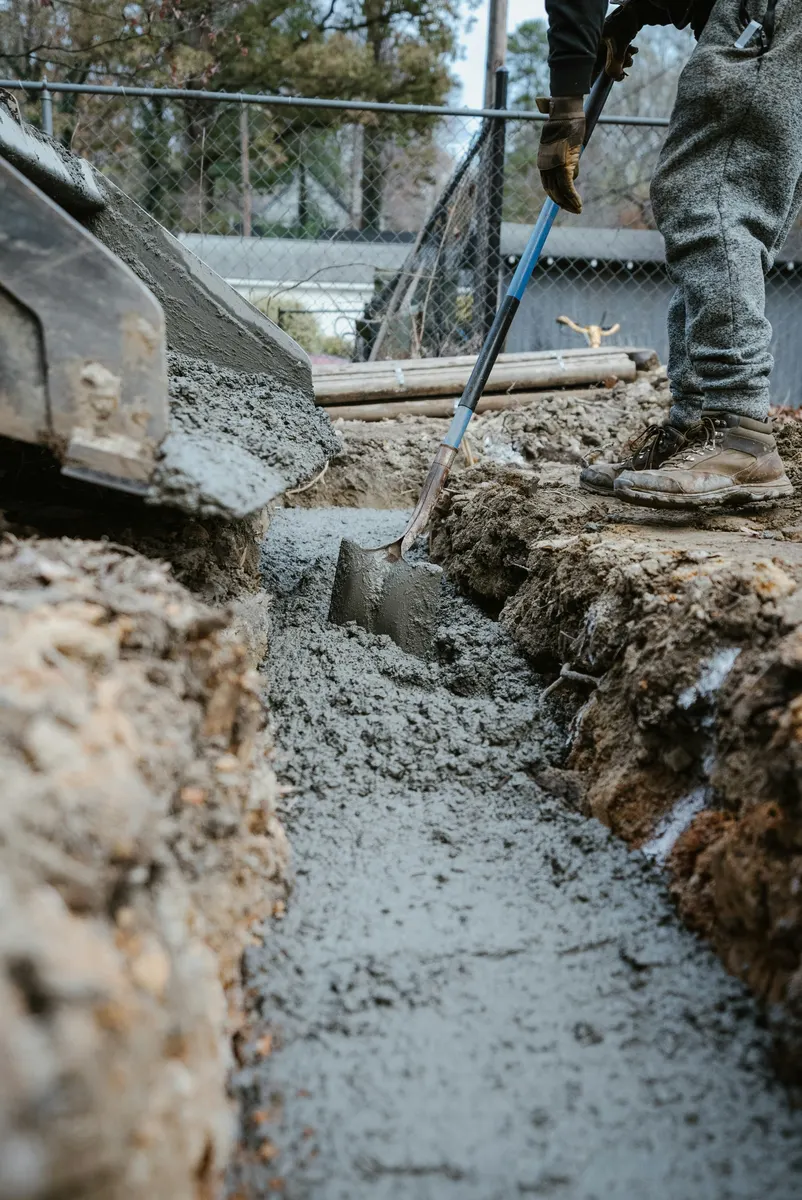 Concrete cutting contractor reviewing job measurements and project costs