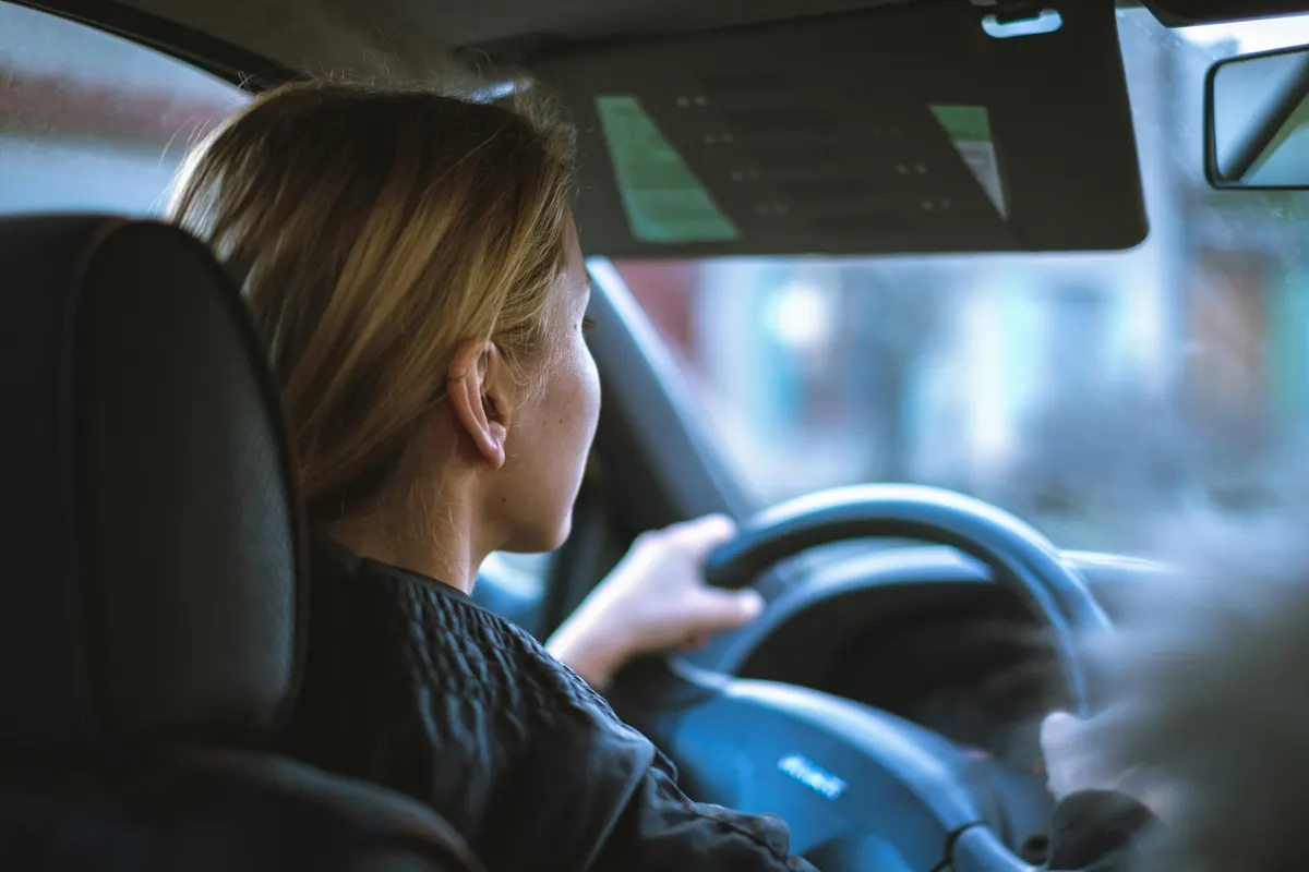 Driving school instructor teaching a pupil during a driving lesson