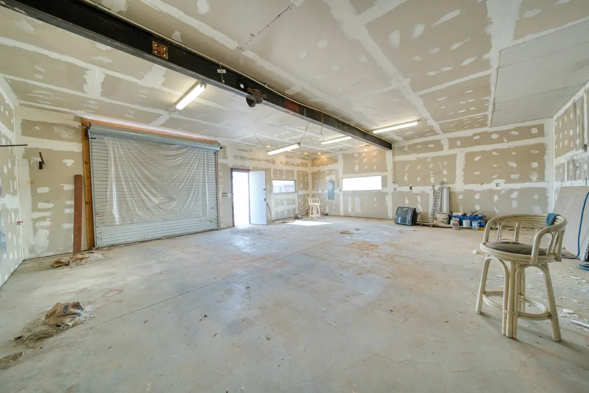 Drywall contractor preparing an invoice for drywall installation and repair work