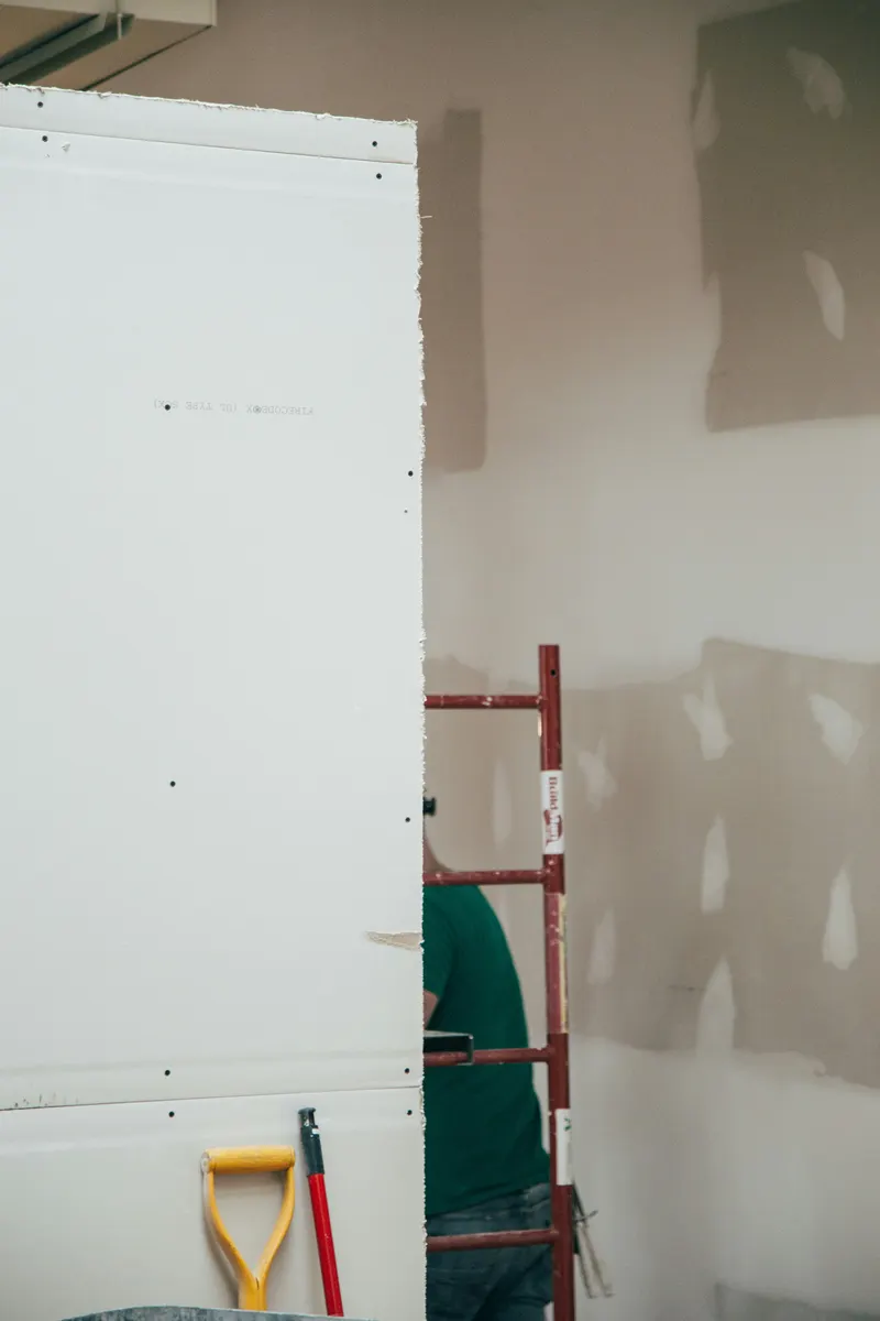 Contractor preparing a drywall estimate template for a customer