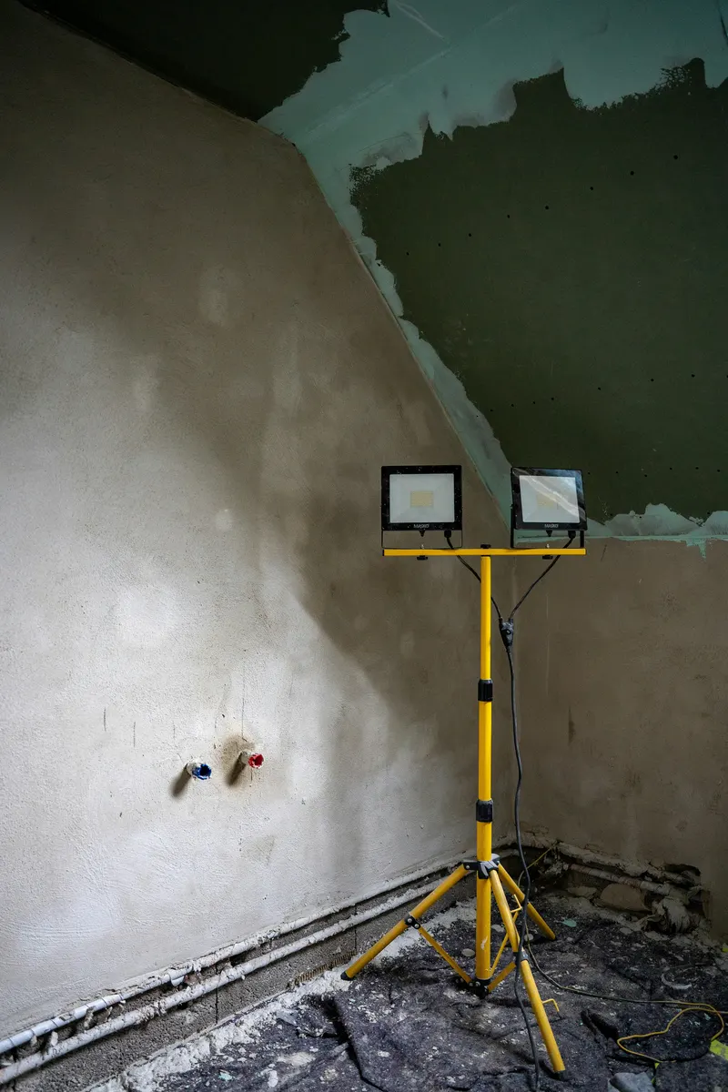 Drywall contractor reviewing an invoice example for installation and repair services