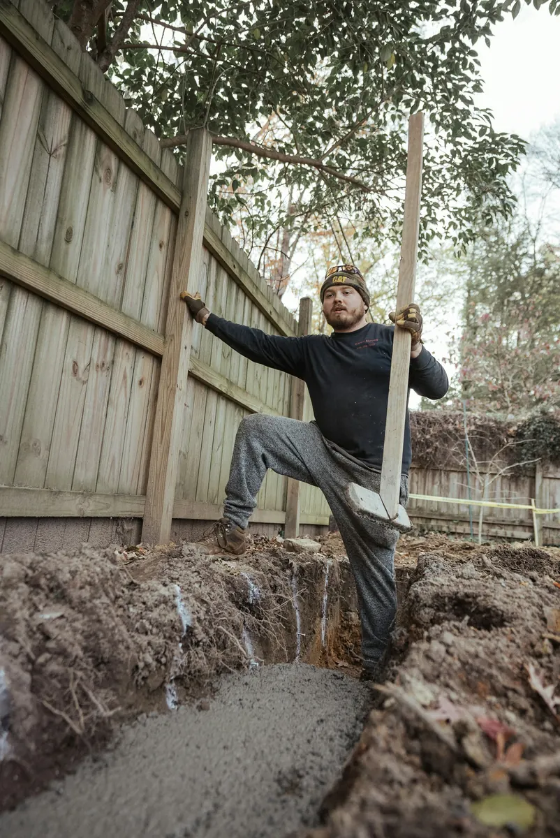 Fence contractor preparing a professional fencing invoice