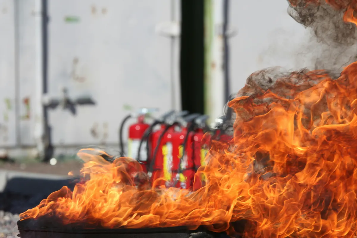 Fire protection technician preparing an invoice for fire safety services