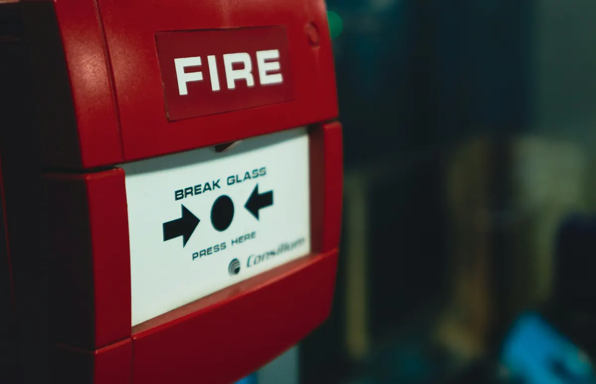Fire alarm and extinguisher technician completing a fire safety service invoice
