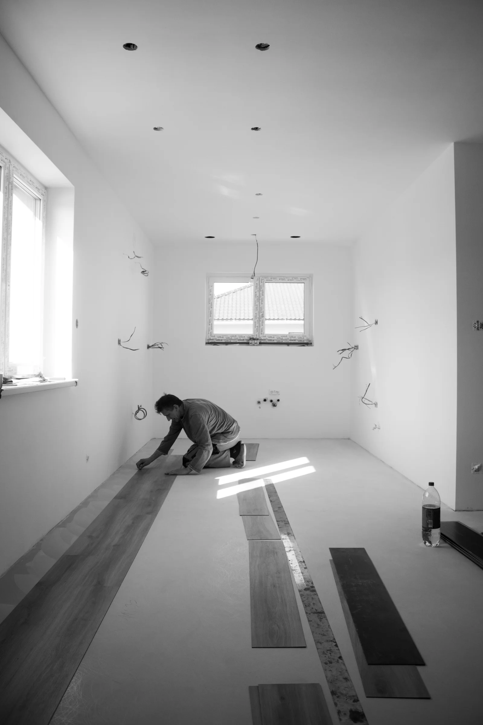 Flooring contractor preparing an invoice after completing installation work
