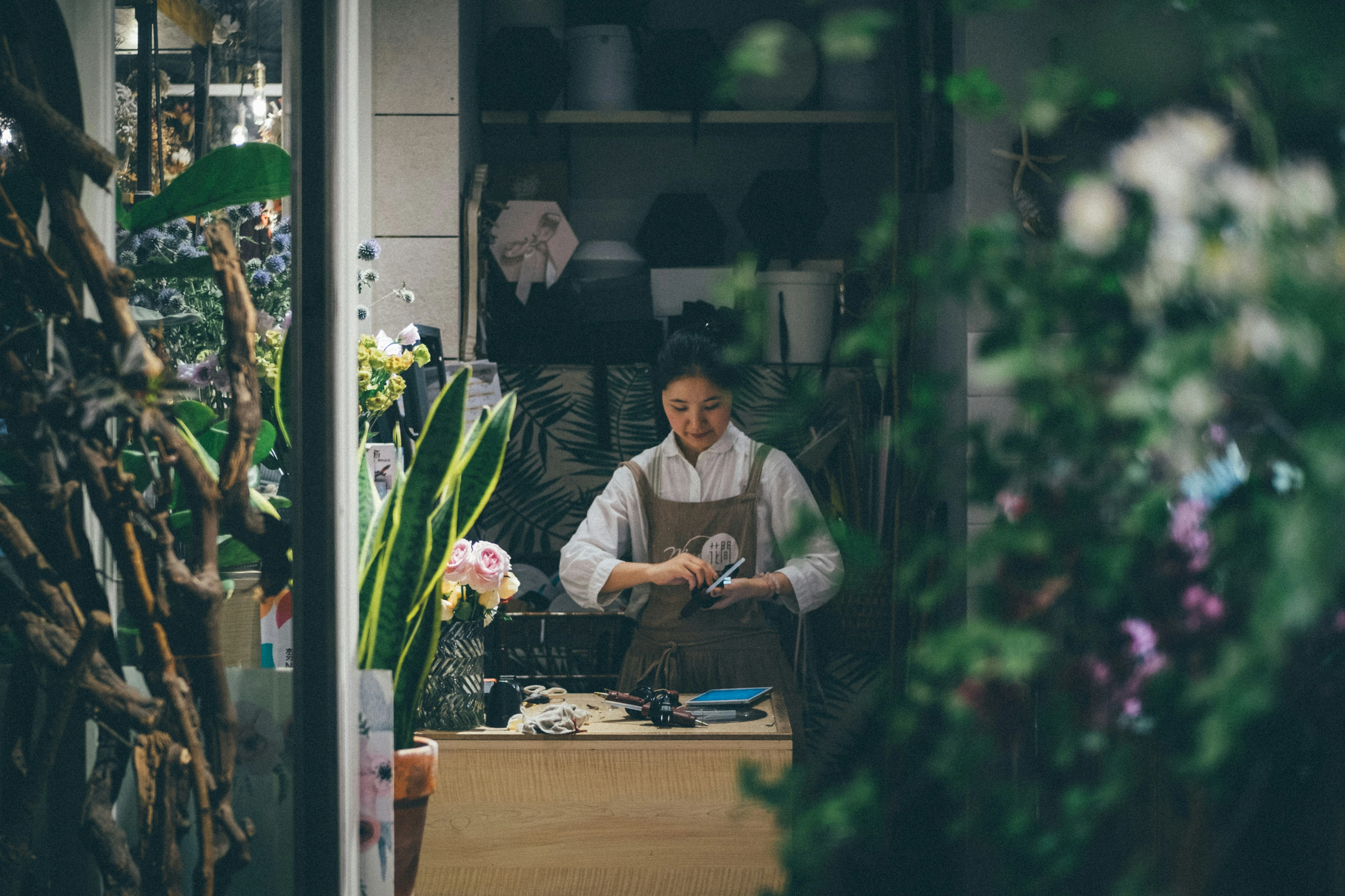 Florist creating a professional florist invoice for flower orders