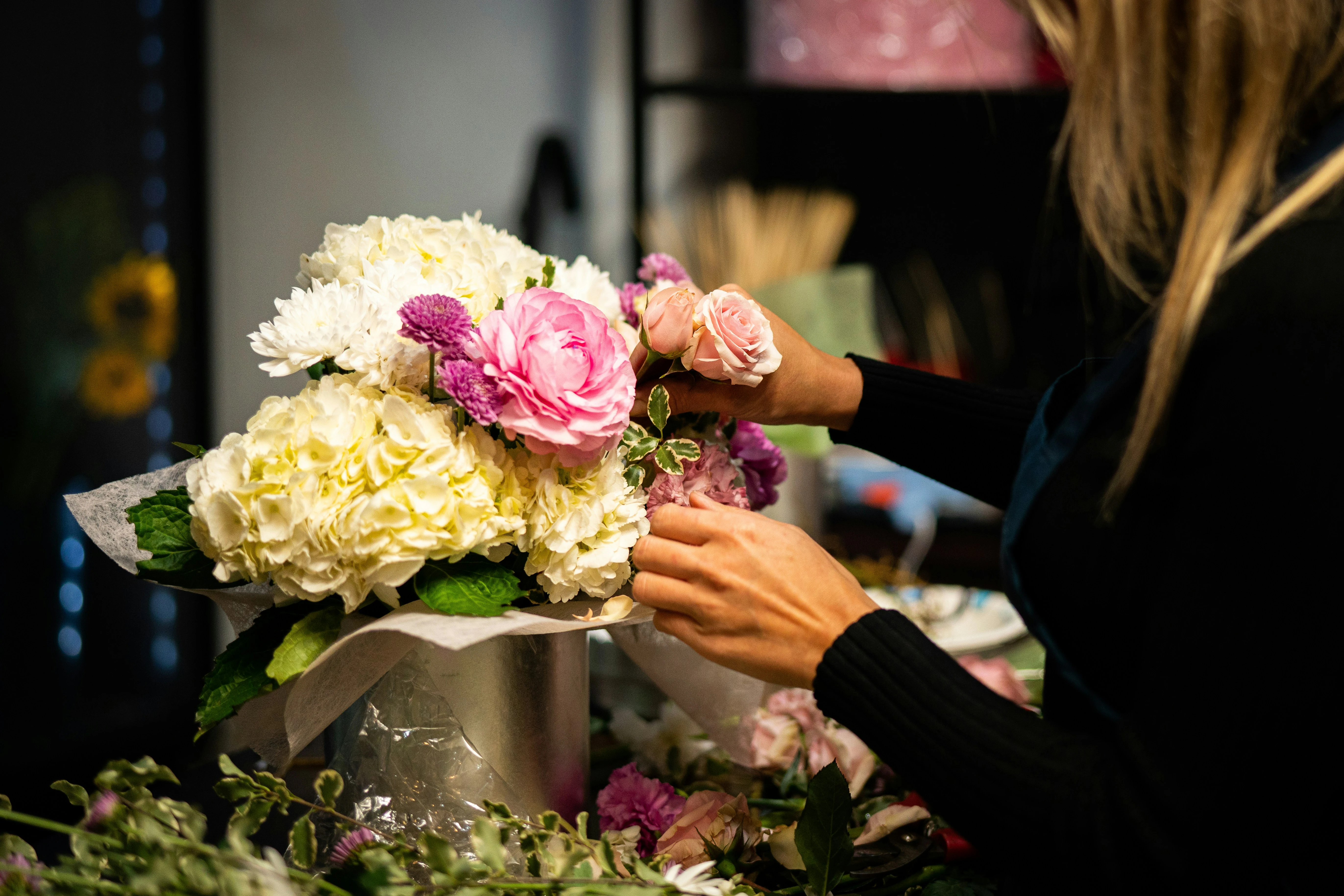 Flower shop owner using a florist invoice template
