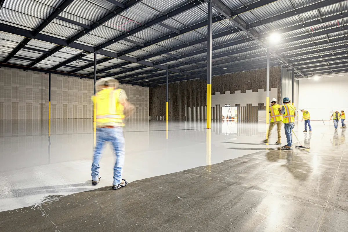 Epoxy flooring contractor preparing an invoice for a garage floor coating