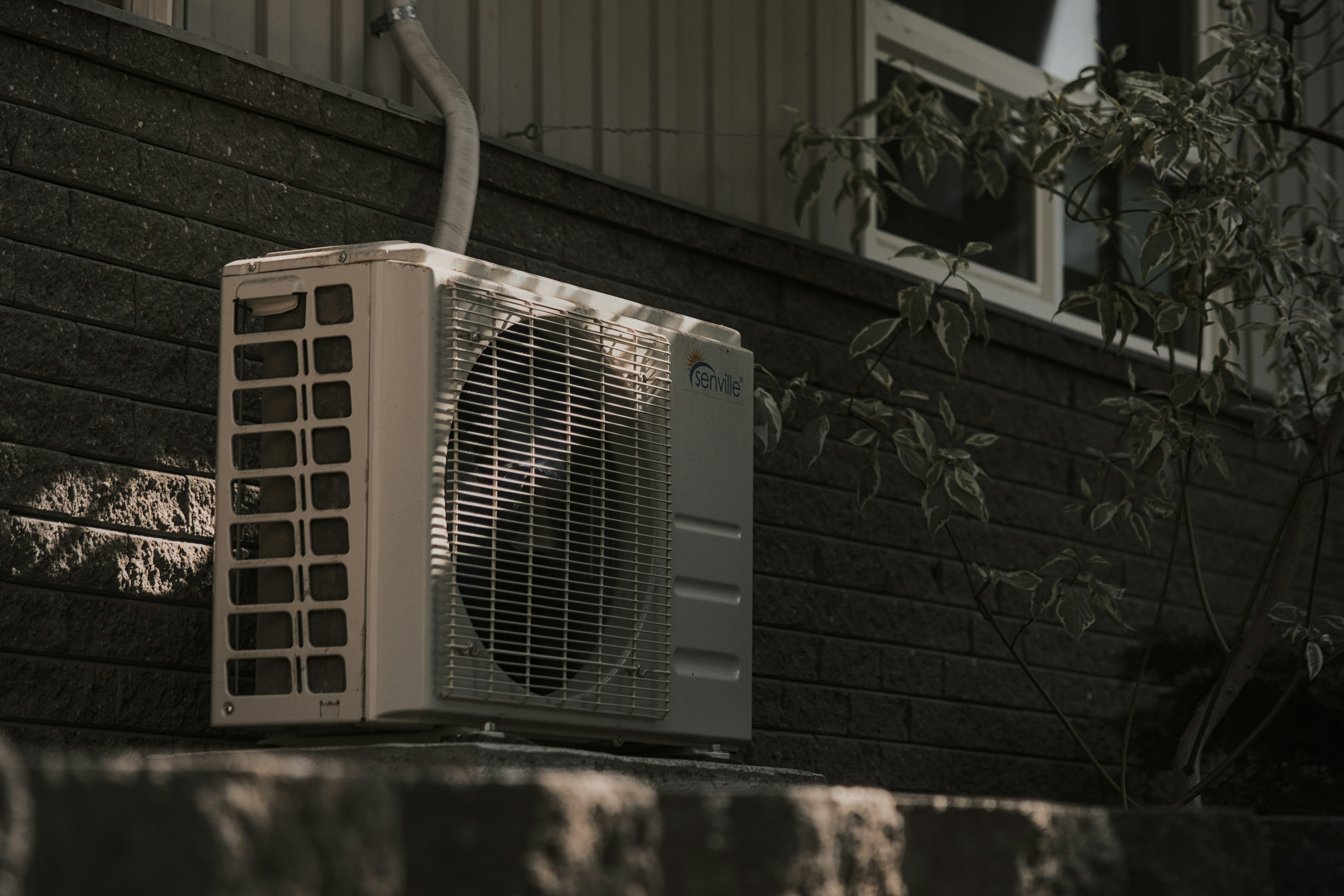 HVAC technician preparing an invoice for air conditioning and heating services