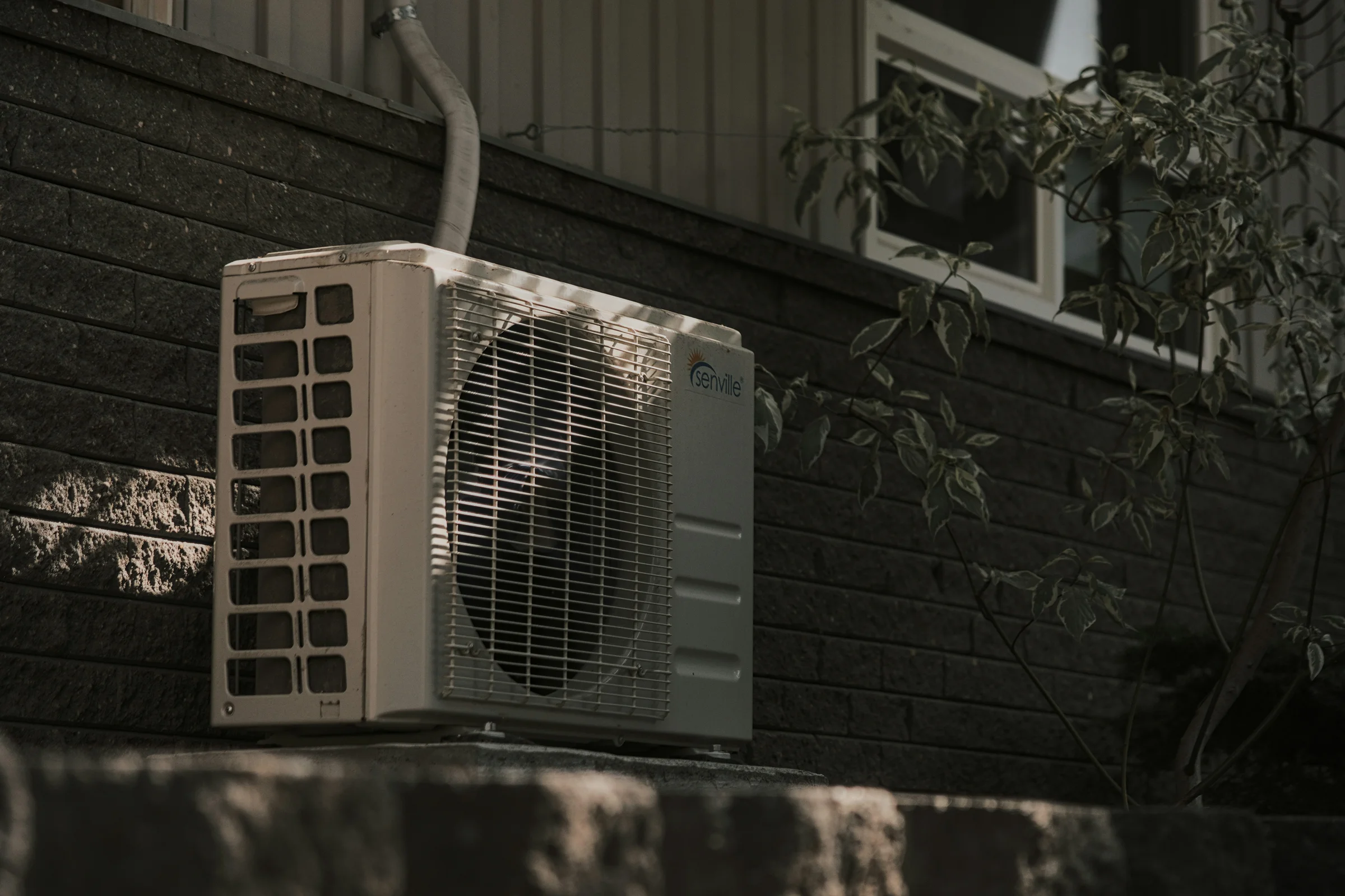 HVAC technician preparing an invoice for air conditioning and heating services
