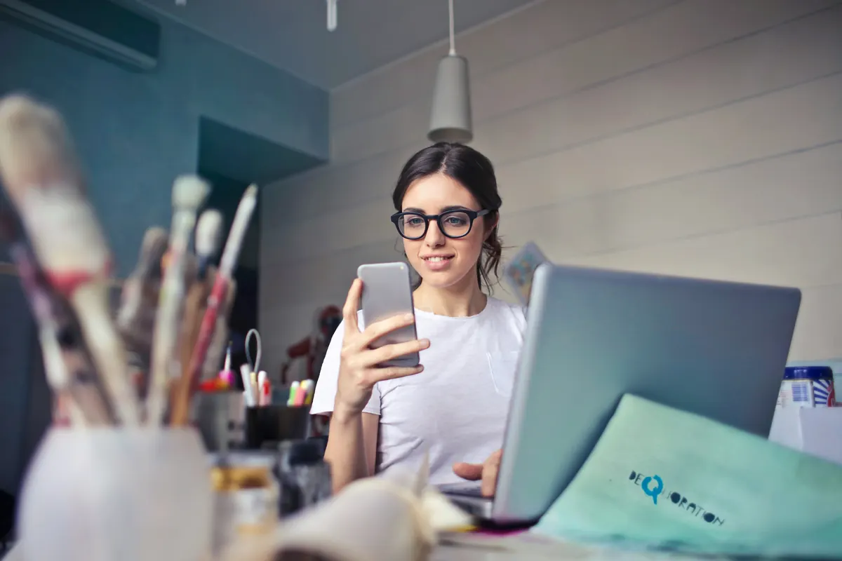 Social media creator completing an editable influencer invoice PDF