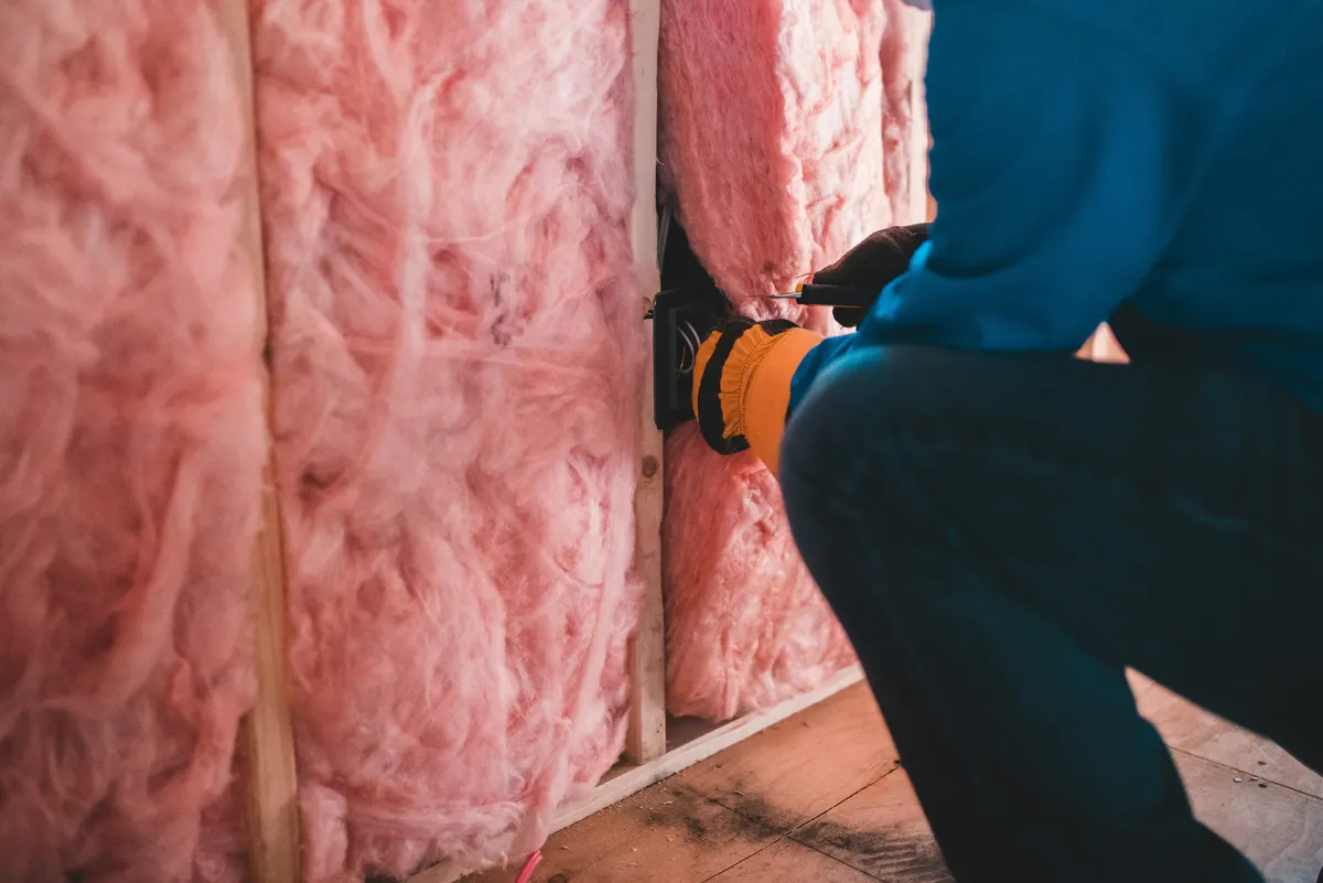 Insulation contractor preparing an invoice for insulation work