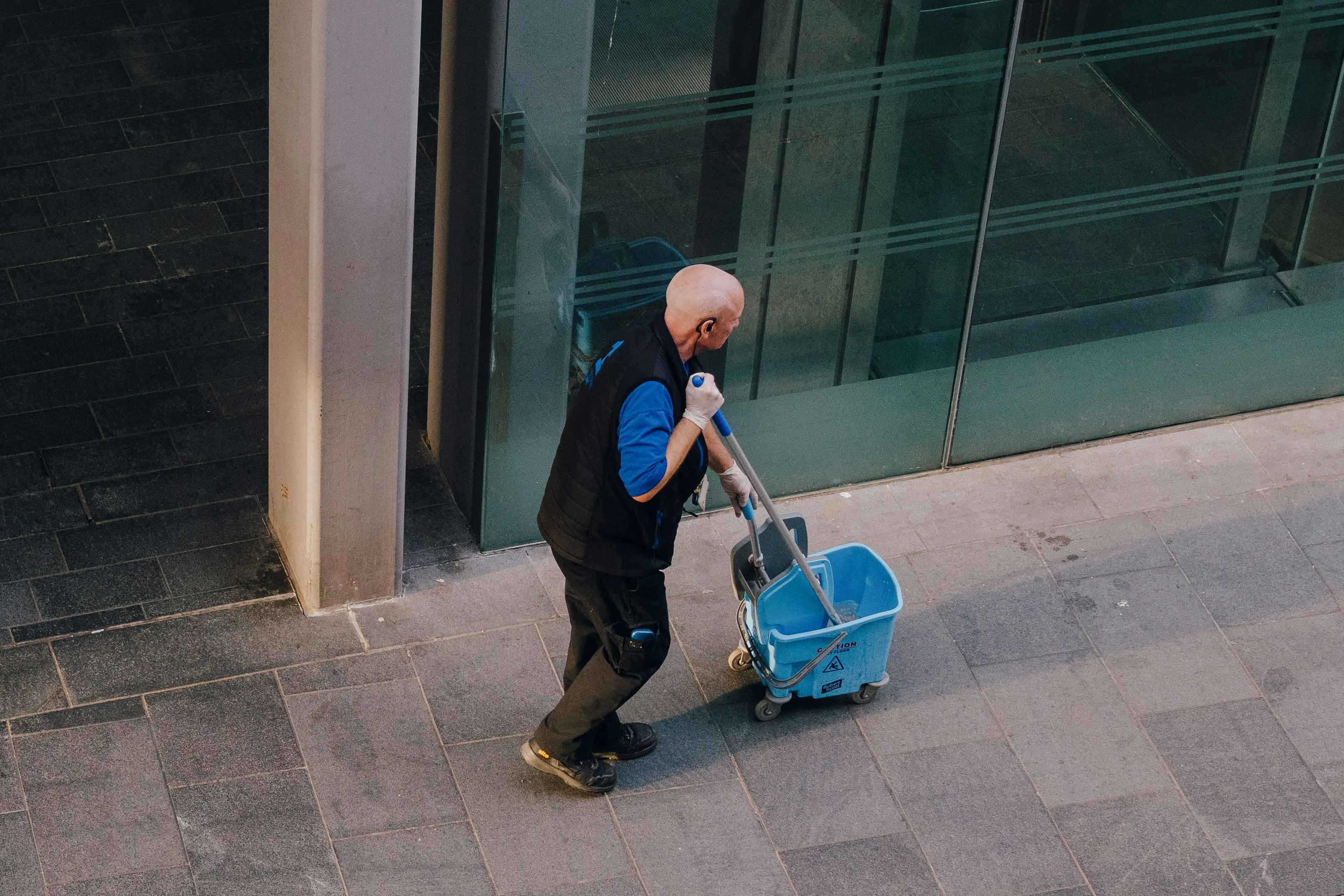 Janitorial worker preparing a janitorial invoice for cleaning services