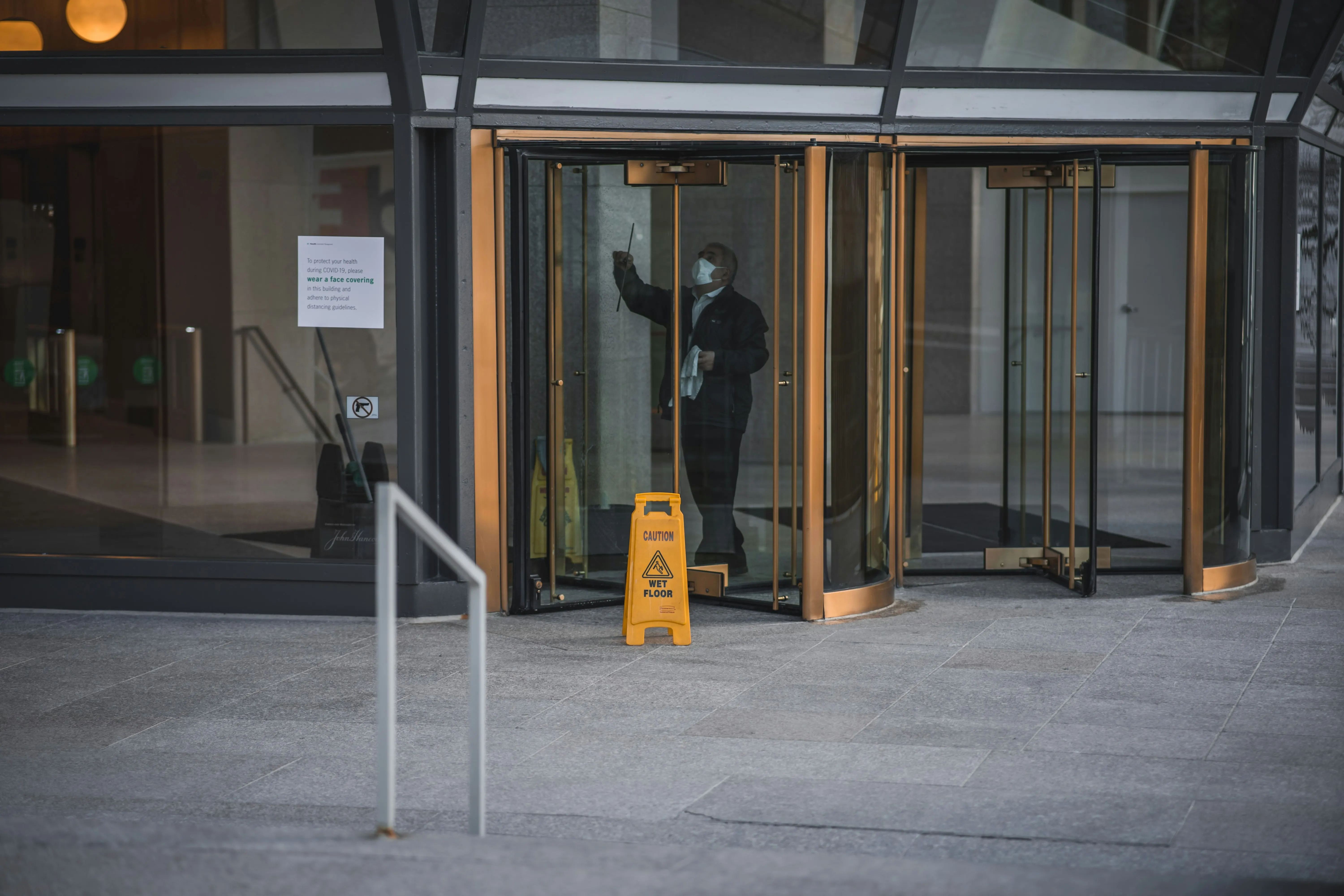 Office cleaner reviewing a janitorial invoice example for commercial cleaning work