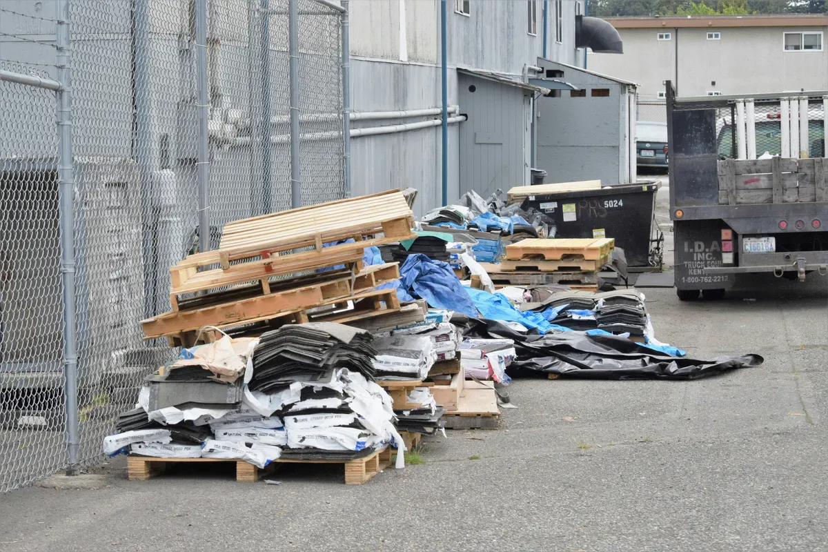 Junk removal company preparing an invoice for waste collection services
