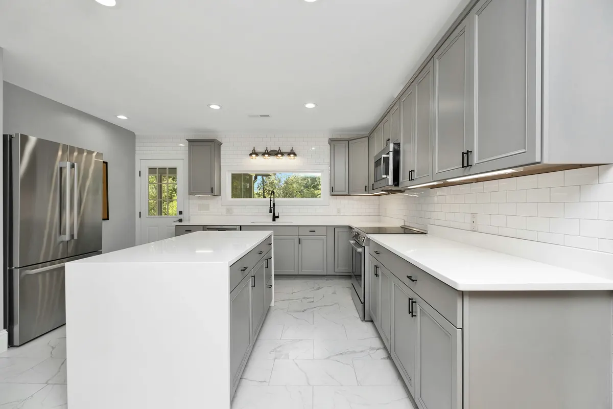 Kitchen fitting contractor reviewing installation costs and customer invoice details