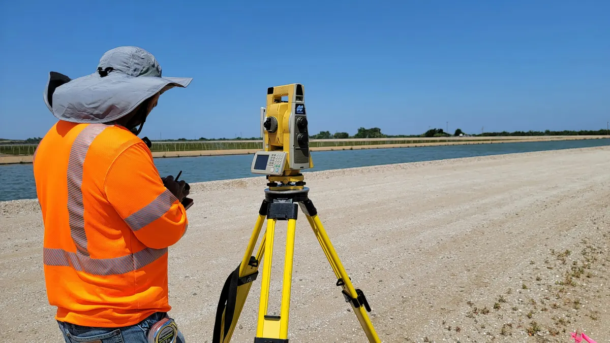Land surveyor preparing an invoice for property surveying services