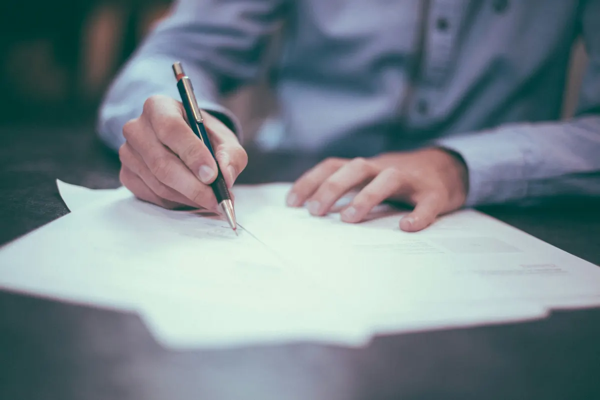 Landlord reviewing a rental invoice and rent payment record