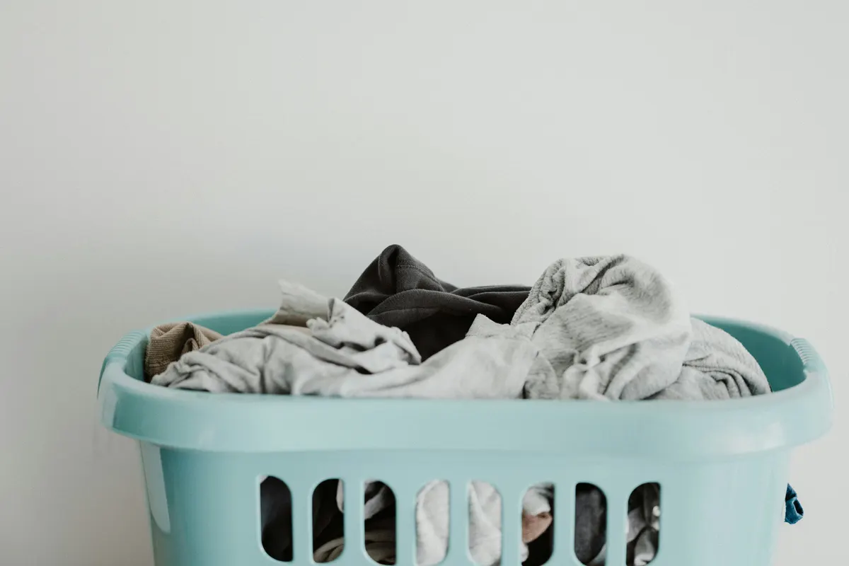 Laundry service organising cleaned clothing and customer billing