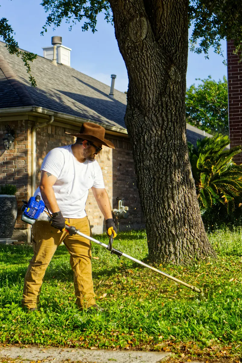 Lawn care professional preparing a lawn care invoice