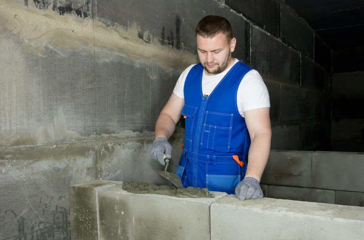 Masonry contractor preparing a professional masonry invoice