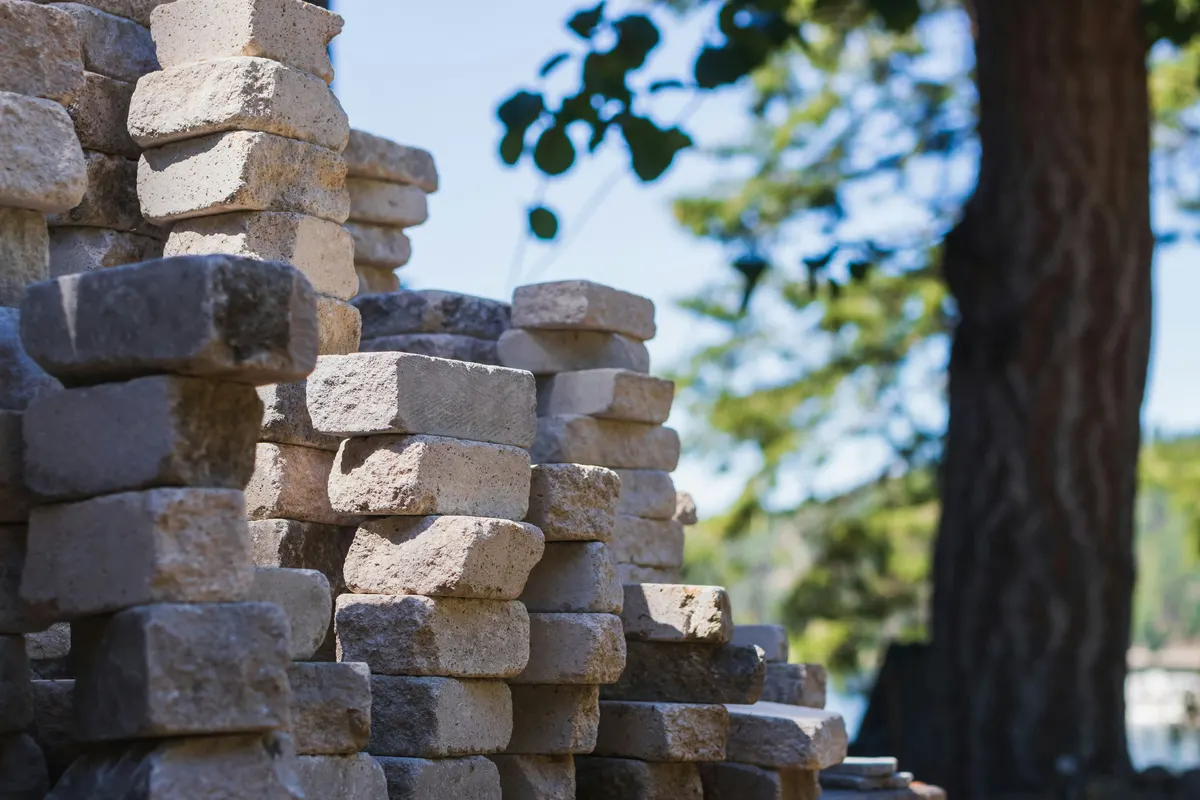 Mason reviewing a masonry invoice example for completed work