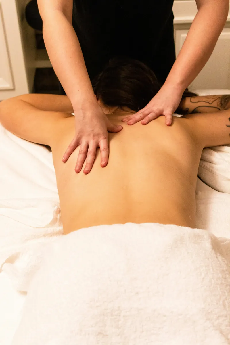 Independent massage therapist completing an editable massage invoice