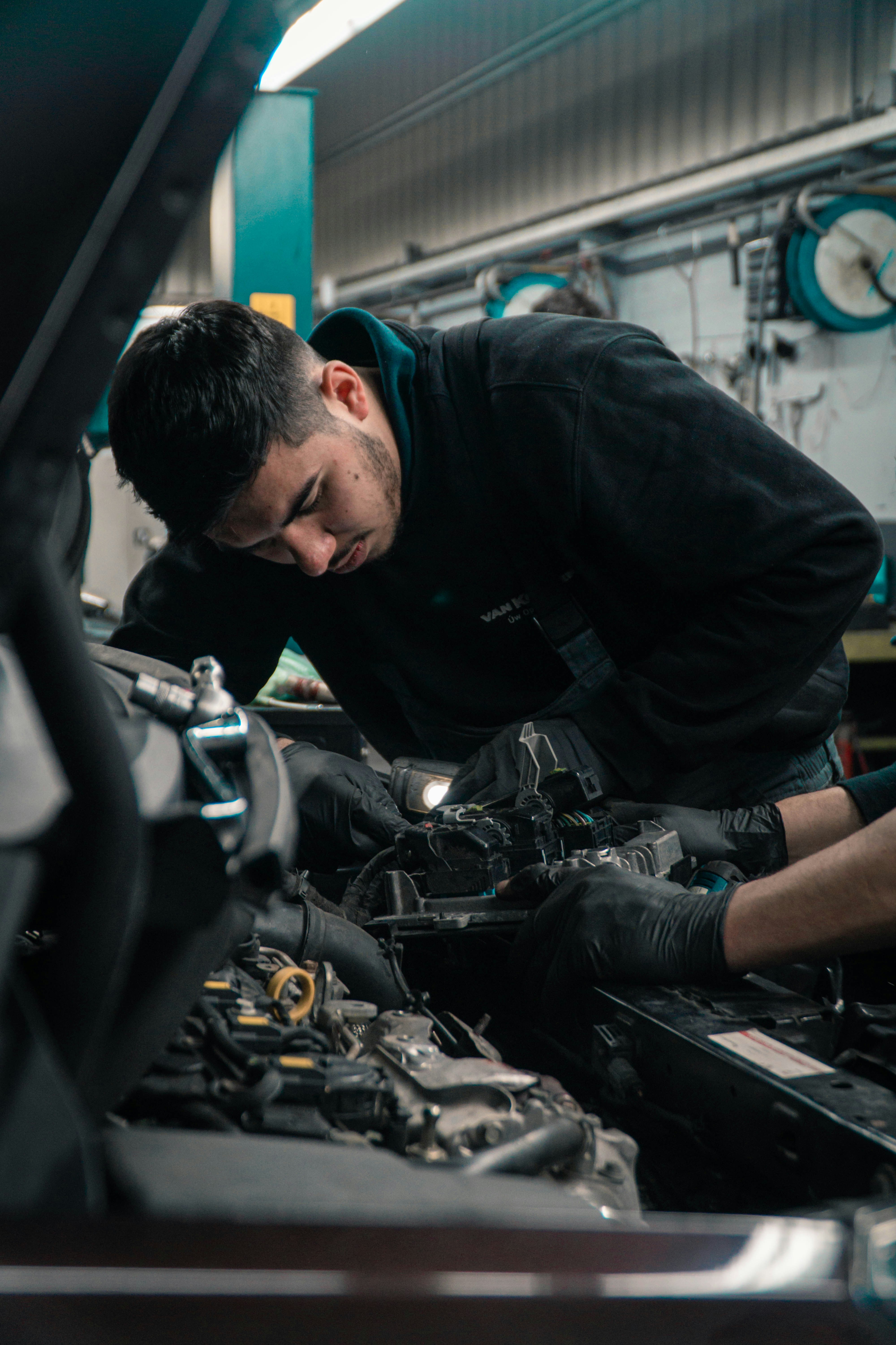 Mechanic preparing an invoice for vehicle repair work