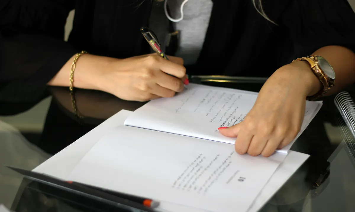 Notary public preparing a notary invoice template after completing document witnessing services