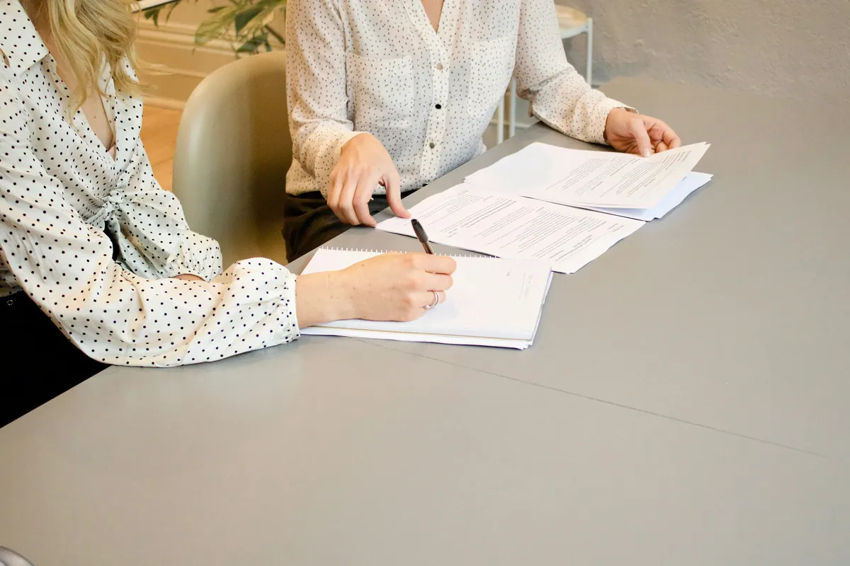 Mobile notary preparing a professional invoice for document signing services