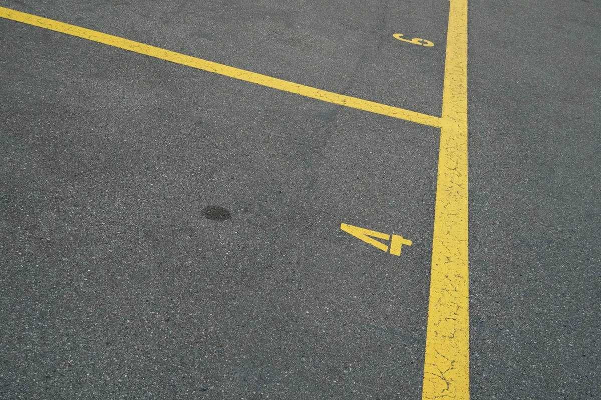 Parking lot striping contractor painting parking space lines