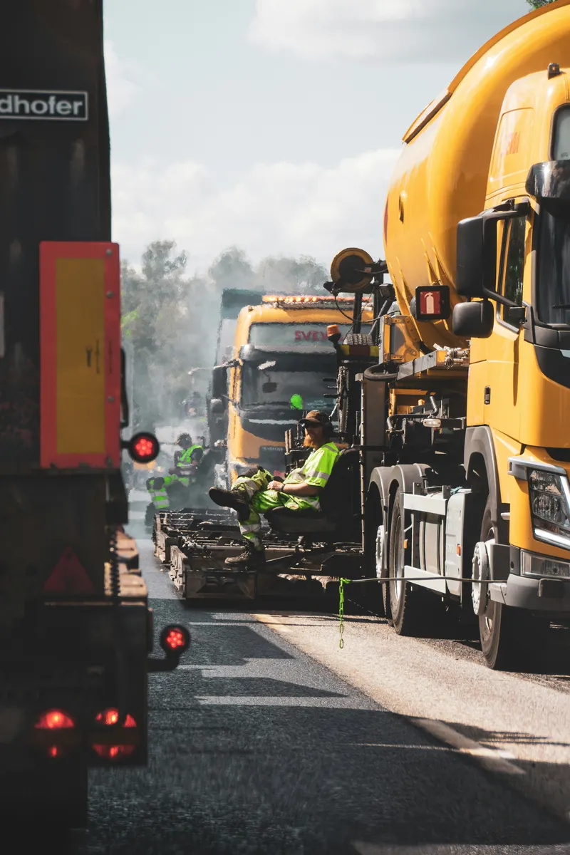 Paving contractor preparing a paving invoice for asphalt work
