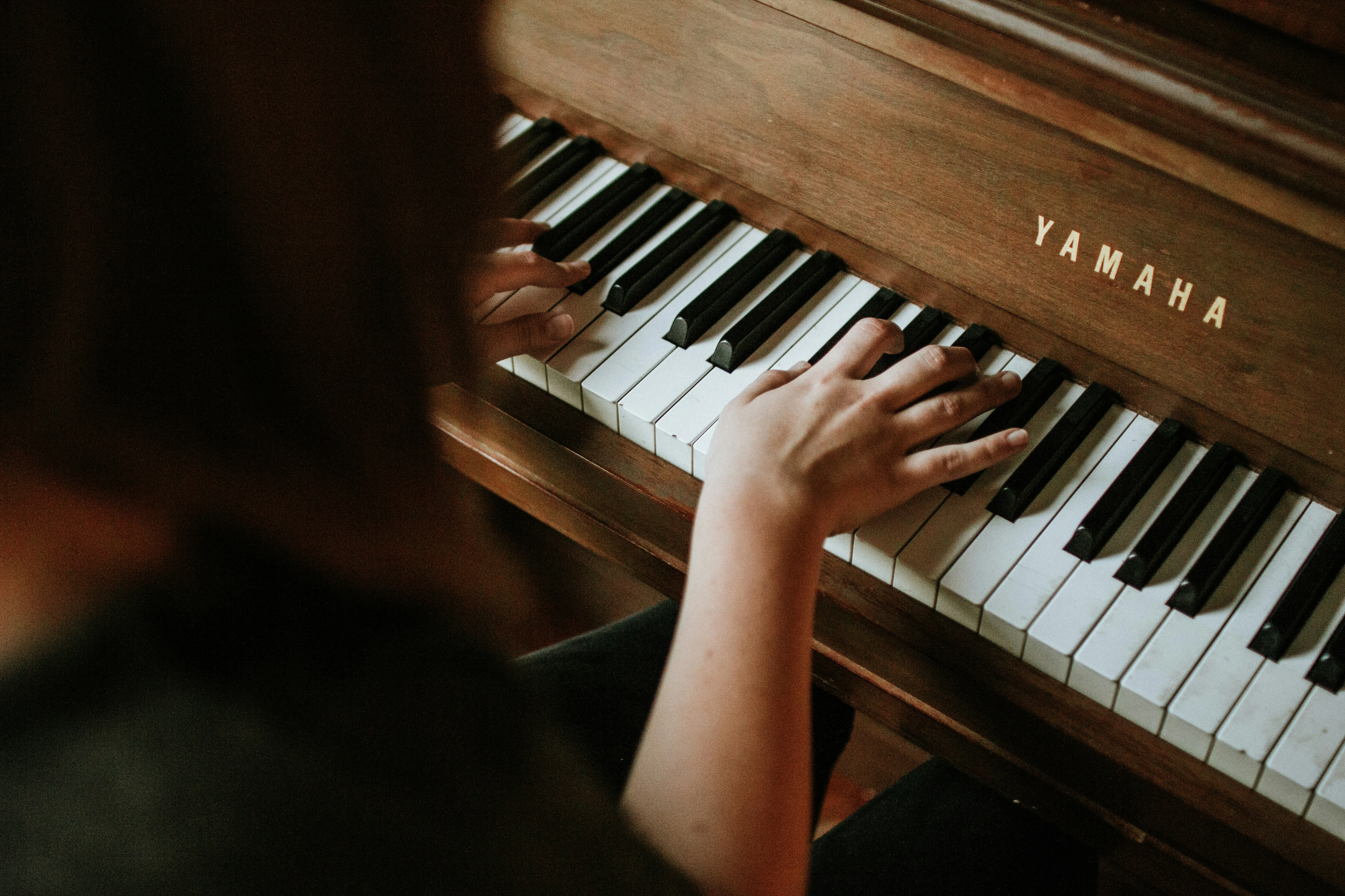 Piano teacher preparing a professional invoice for music lessons
