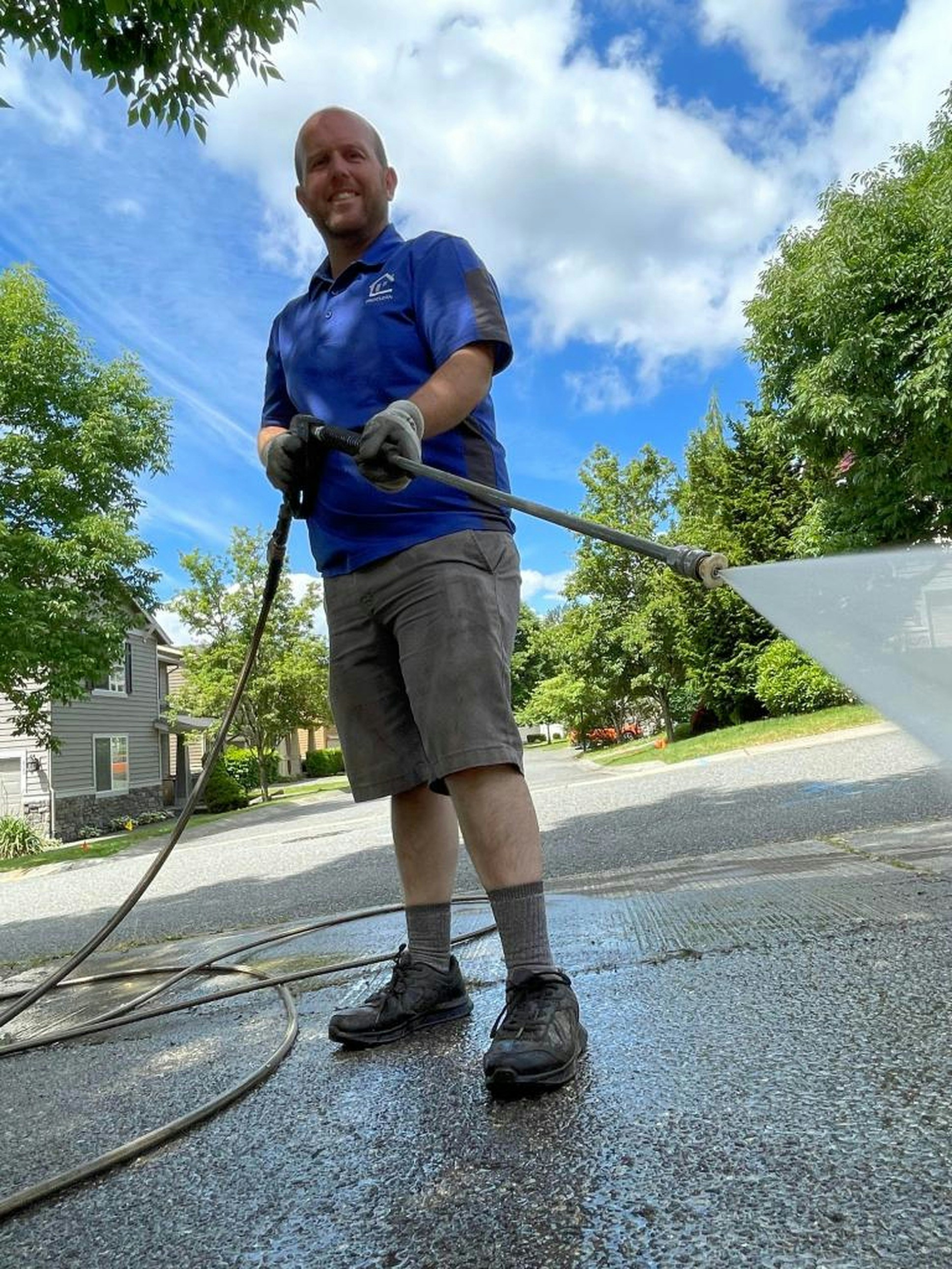 Pressure washing contractor preparing an invoice for driveway cleaning services