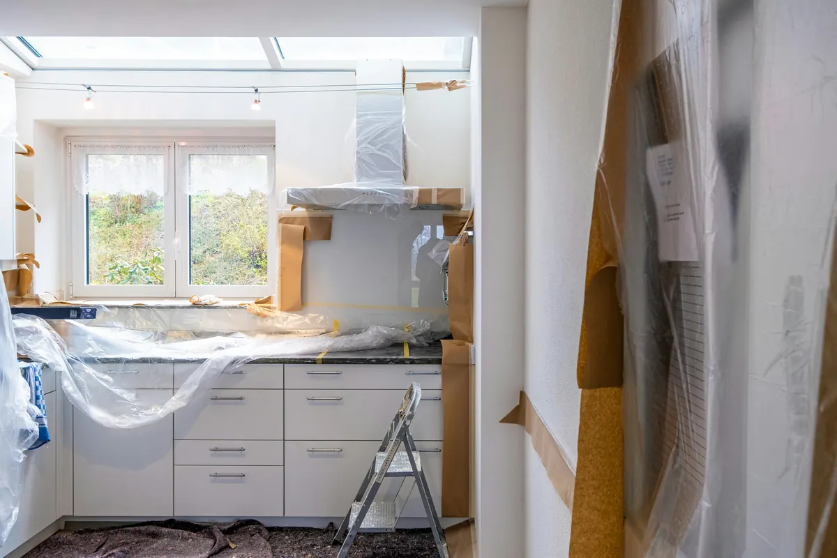 Remodeling contractor preparing a remodeling invoice template for home renovation work