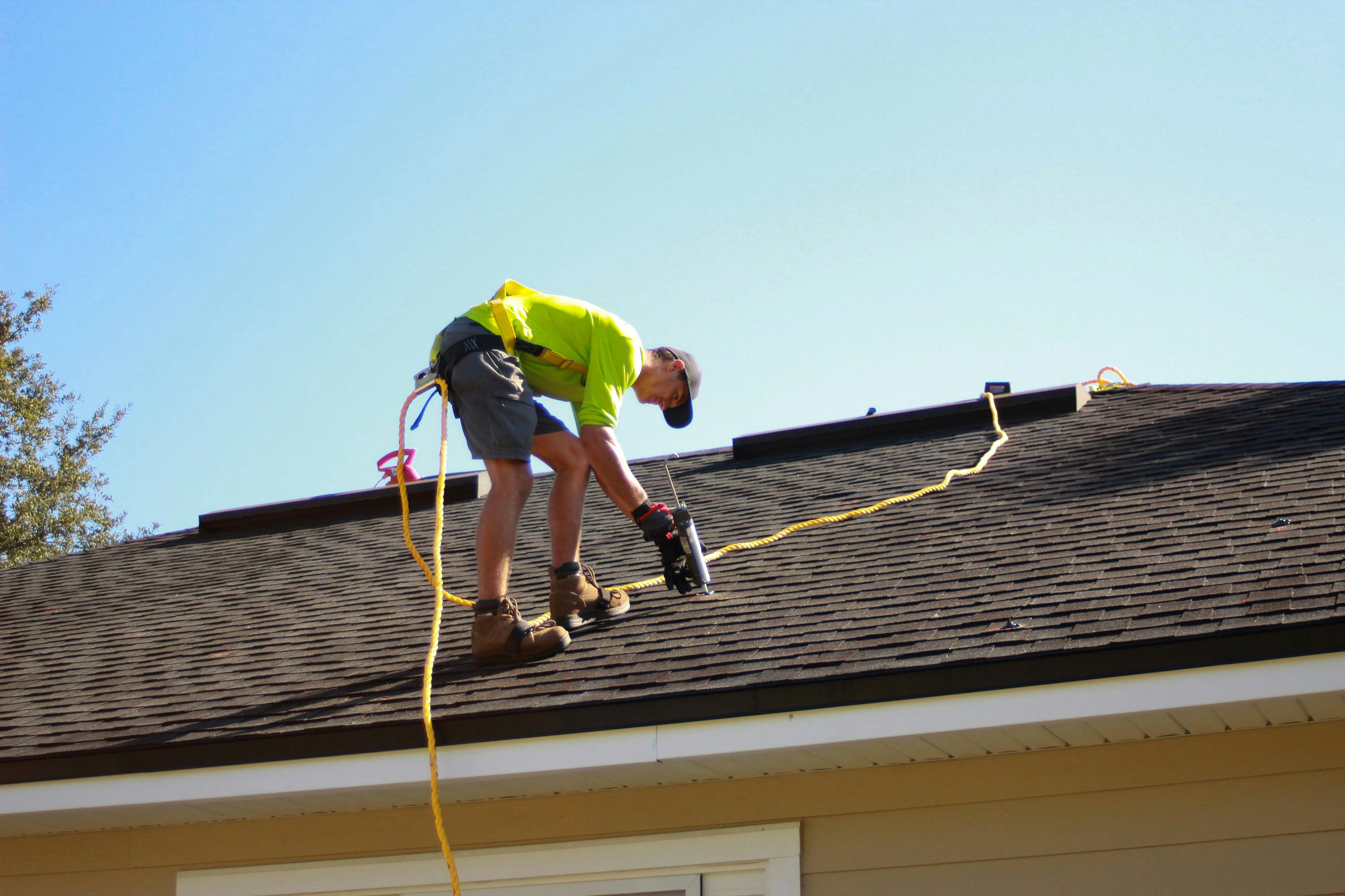 Roofer preparing an invoice for roofing and roof repair work