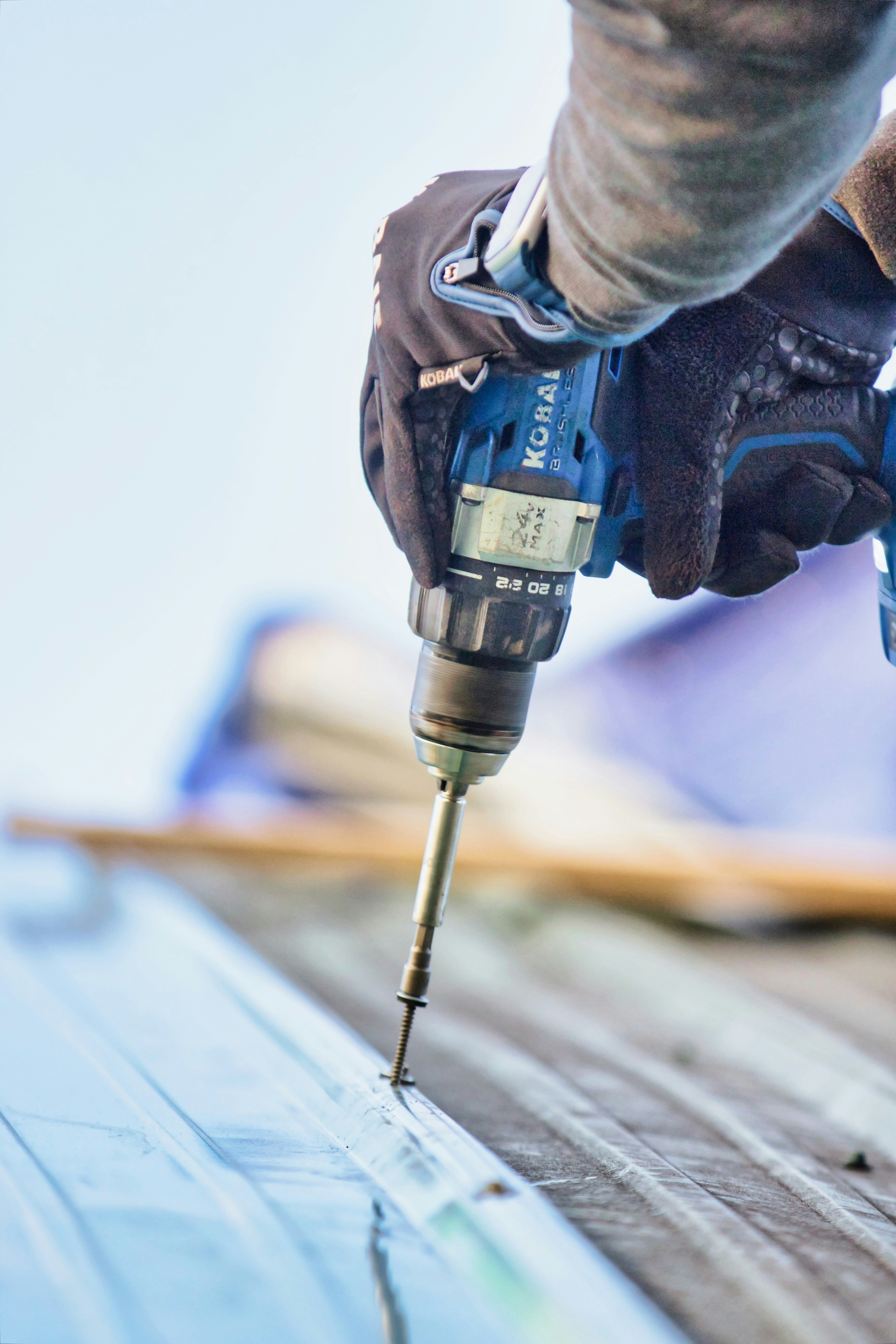 Roofing contractor using a roofing invoice template for customer billing
